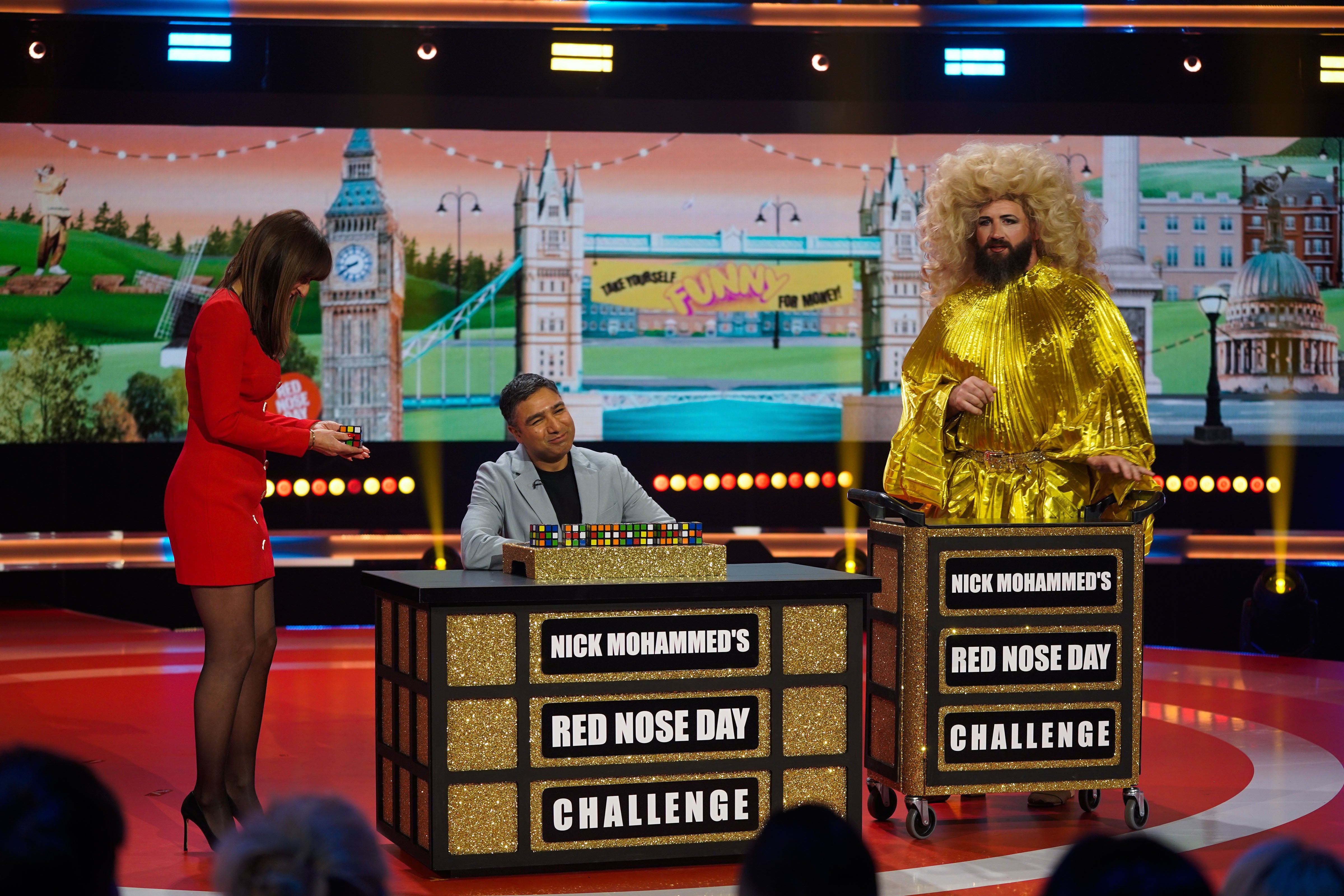 Celebrity Traitors stars Nick Mohammed and Joe Marler on stage with Davina McCall