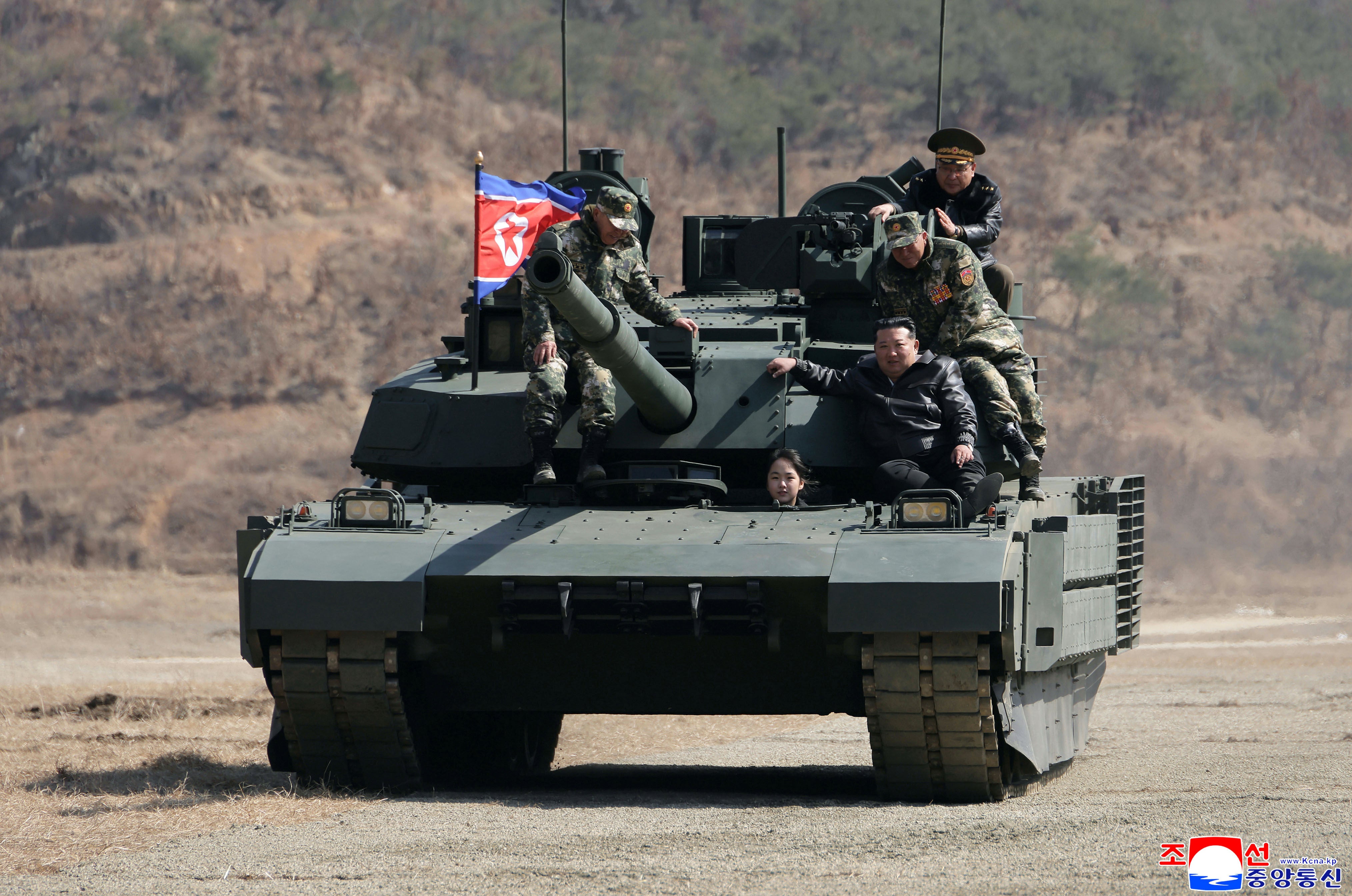 North Korea's Kim Jong Un and his teen daughter seen riding battle tank in latest public appearance | The Independent