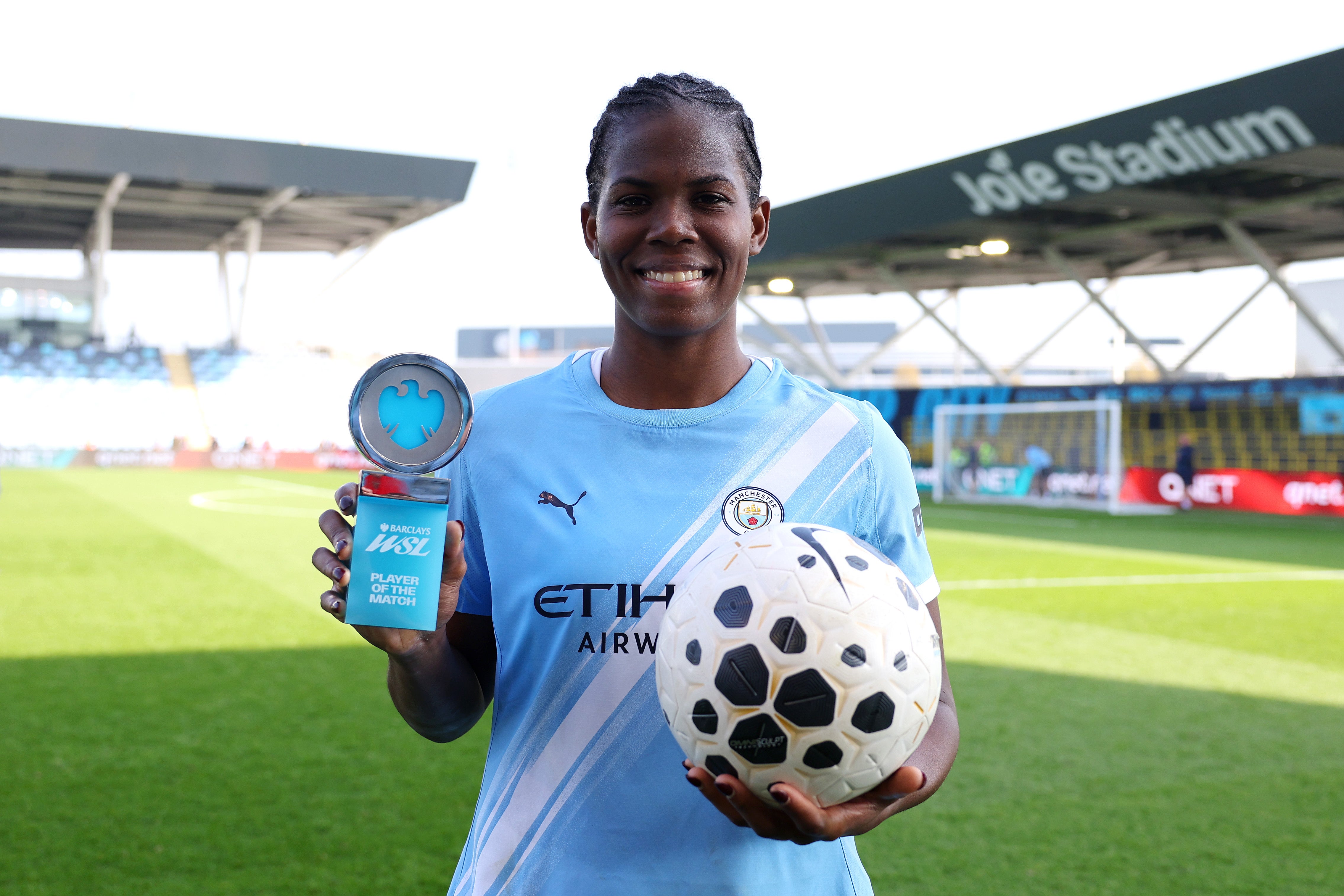 The Jamaica international with the match ball and player of the match award