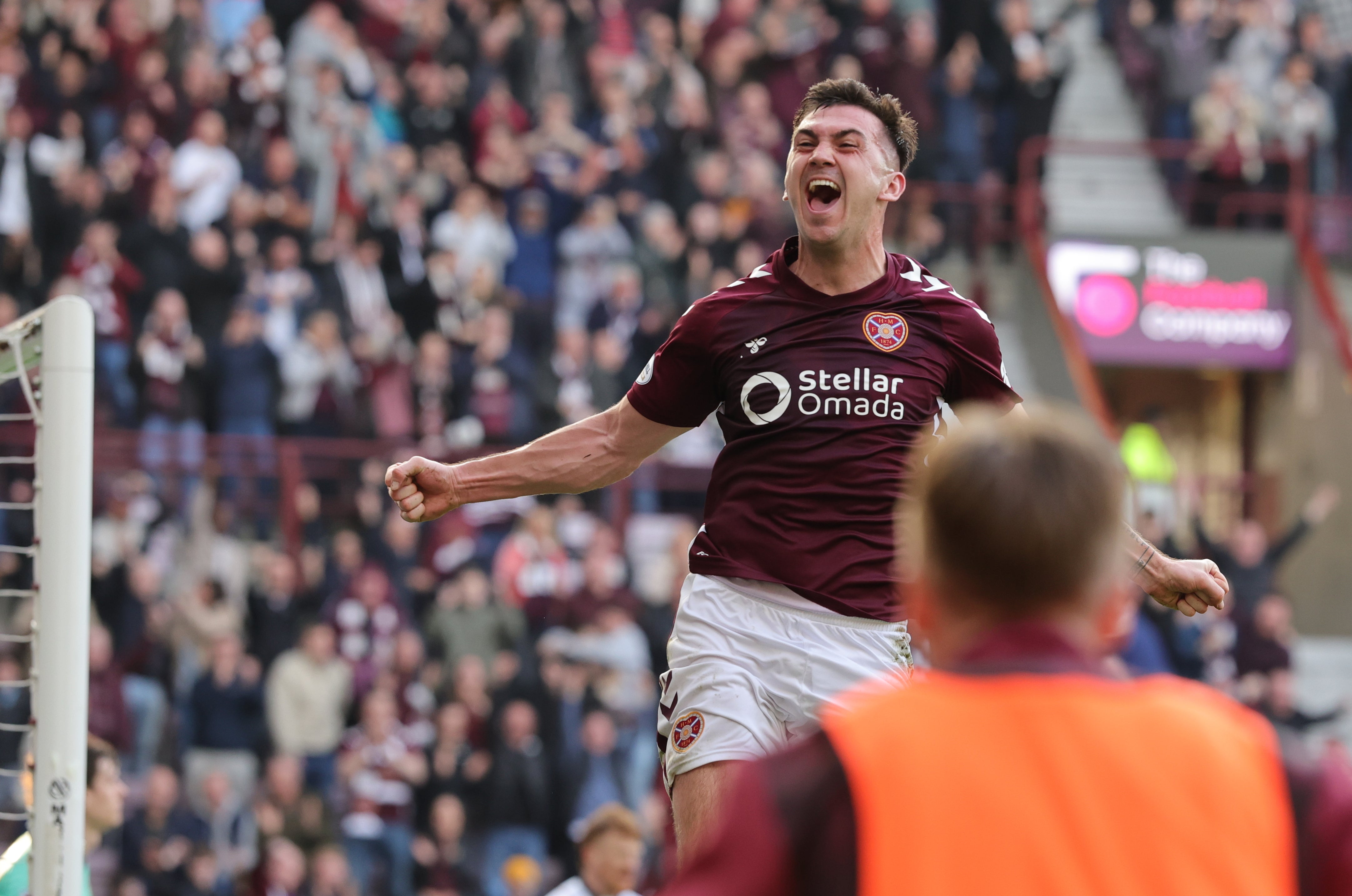 Heart of Midlothian's Oisin McEntee celebrates scoring the winner at a tense Tynecastle