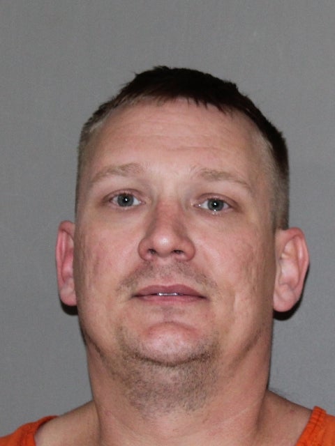 Michael Chadwick Fry is accused of throwing a bucket of human remains stolen from a nearby cemetery over the fence of the FBI Dallas office