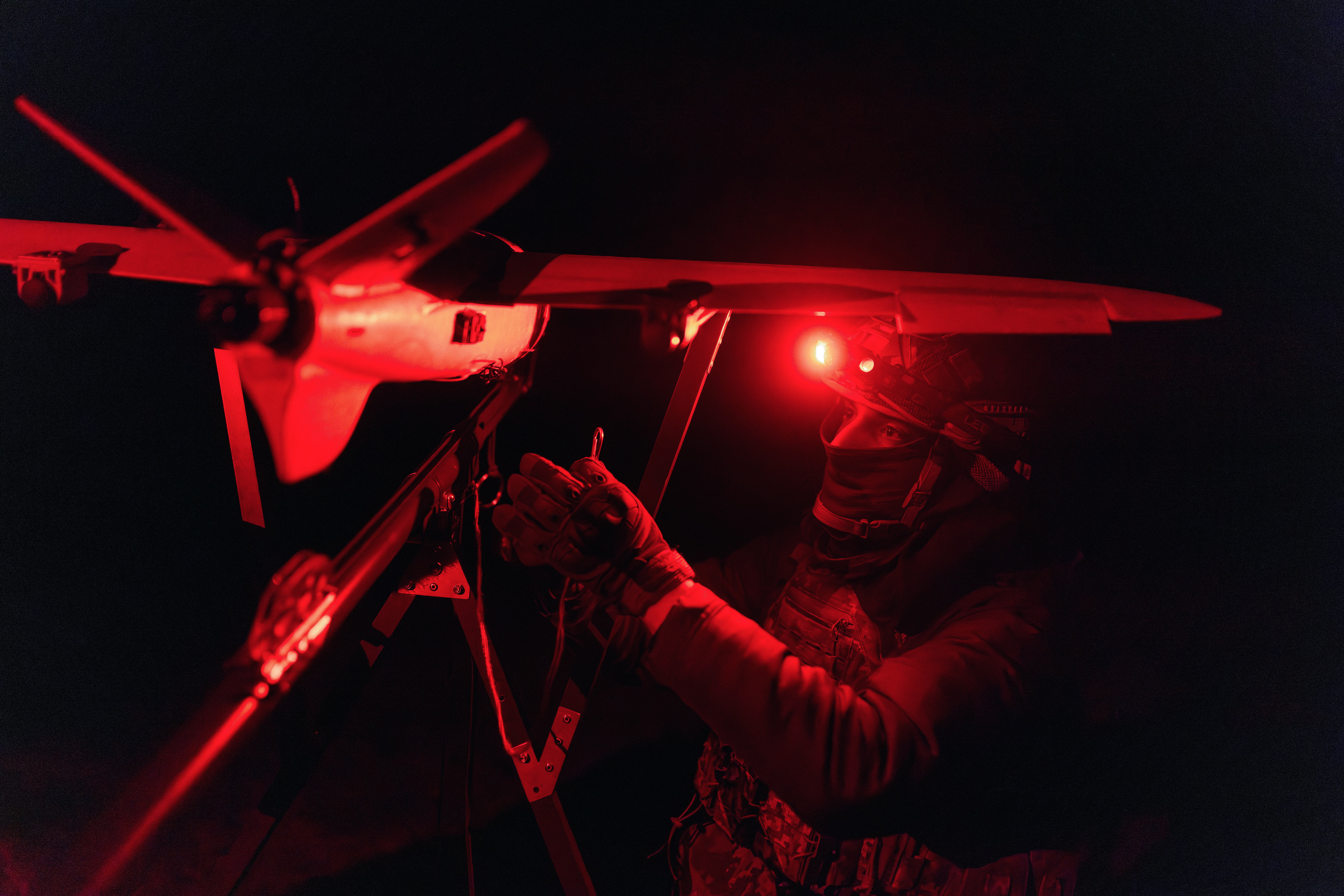 A soldier of the 127th Separate Territorial Brigade launches a drone to search for Russian attack drones at the front line in the Kharkiv region Saturday, 14 March 2026