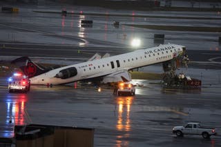 LaGuardia plane crash live updates: Two dead after Air Canada flight hits fire truck