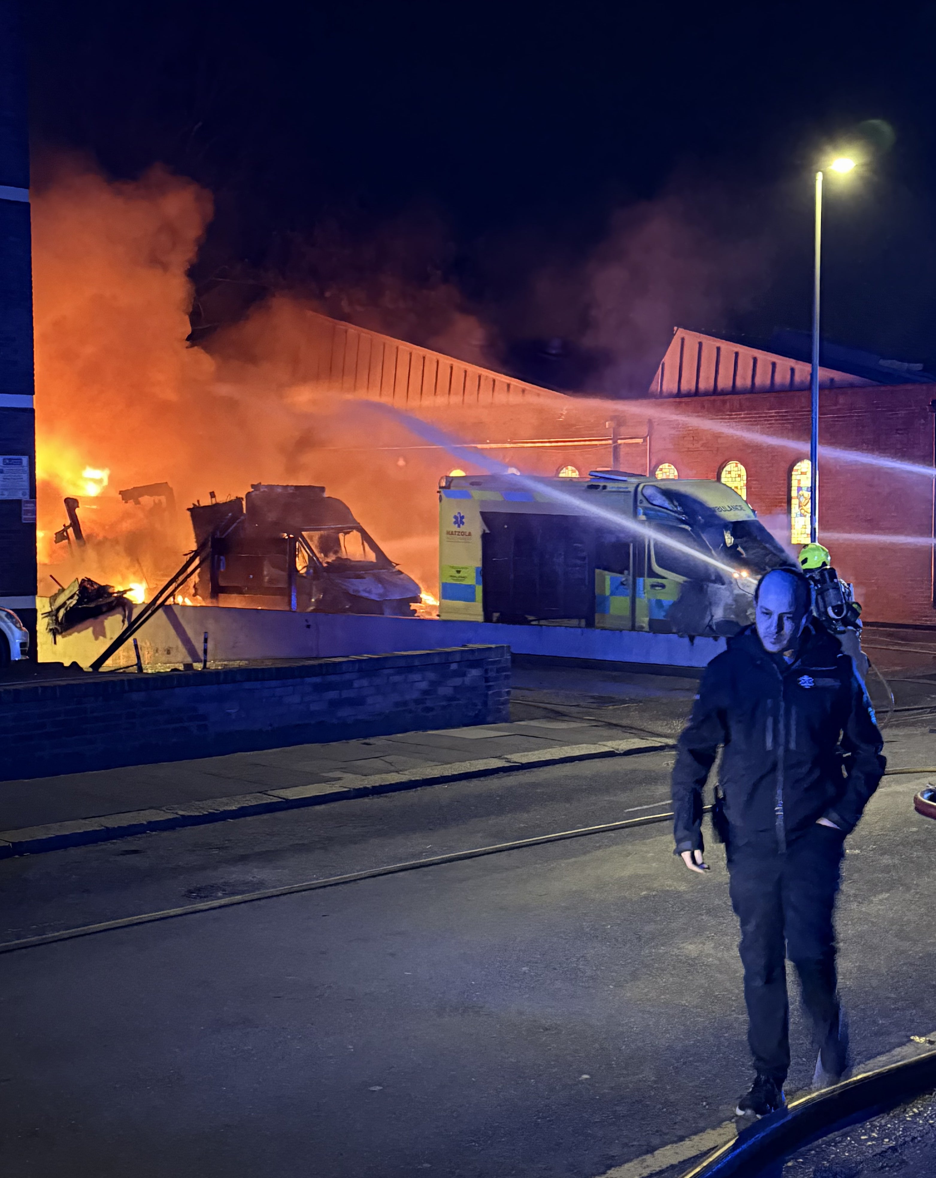 Firefighters attend to the blaze in north London (PA)