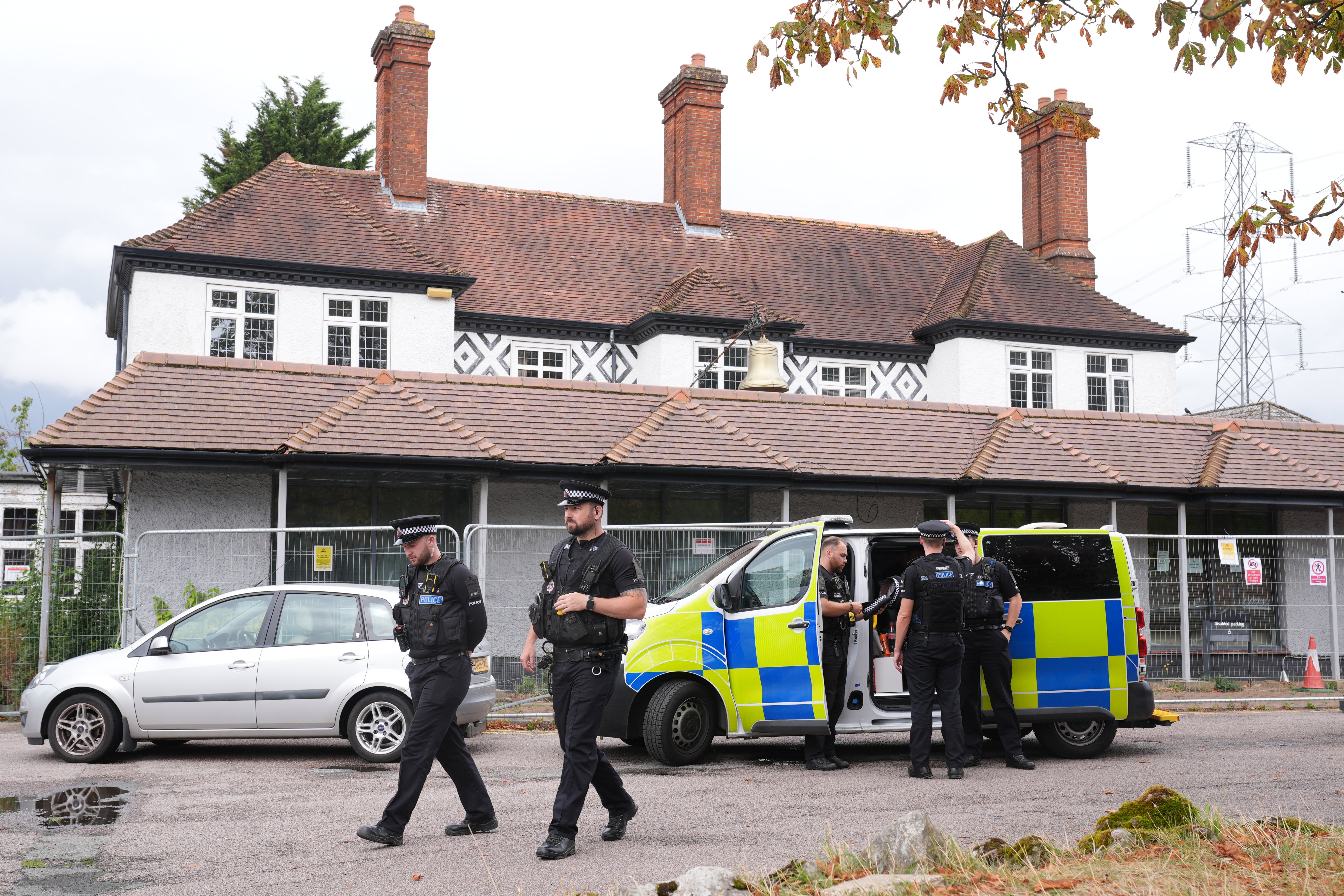 Police presence outside the Bell Hotel in Epping, Essex (Lucy North/PA)