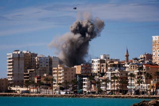 A plume of smoke from an Israeli airstrike on the eastern outskirts of Tyre, 24 March