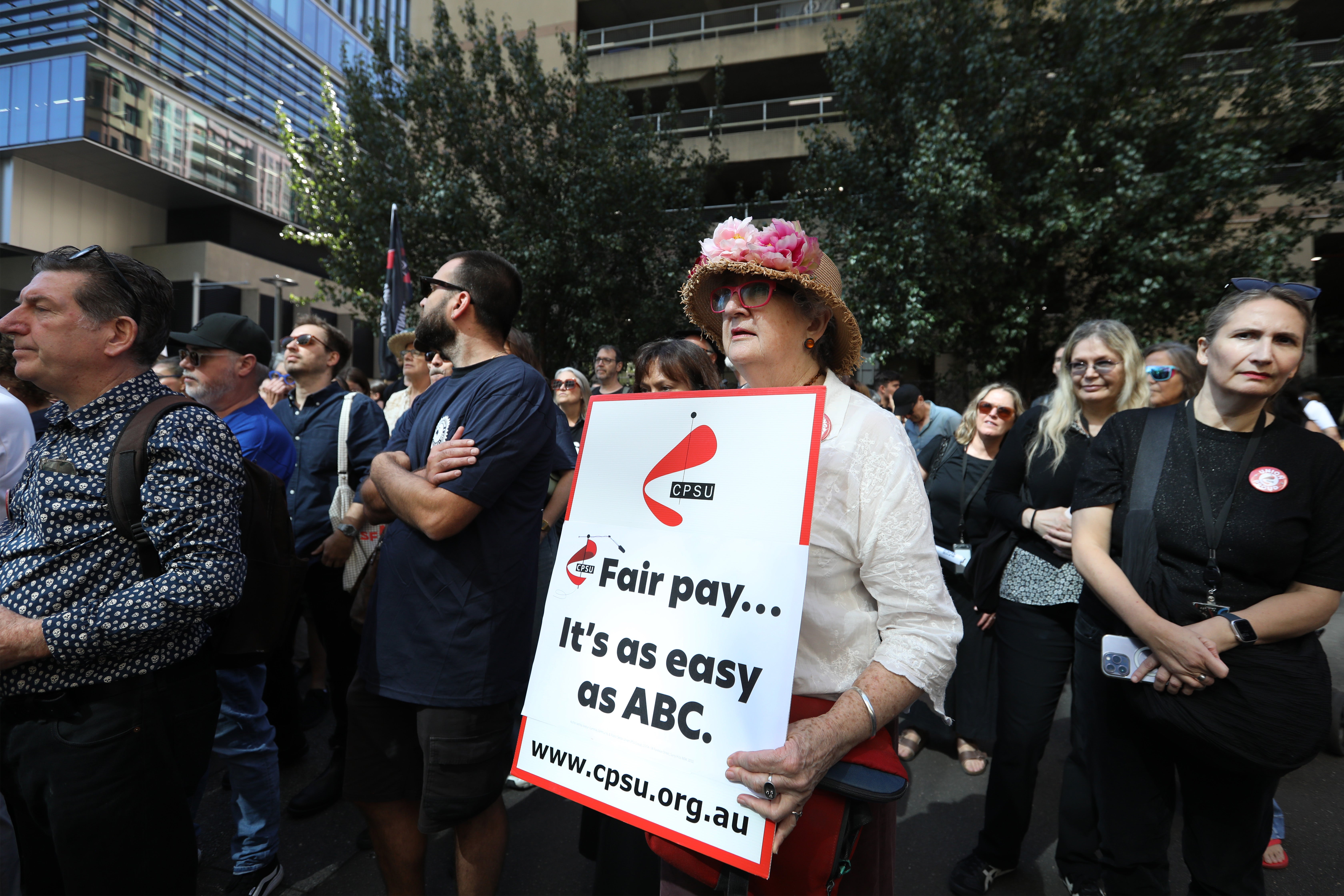Australian Broadcasting Corporation (ABC) staff walk off the job during industrial action at the ABC headquarters in Ultimo