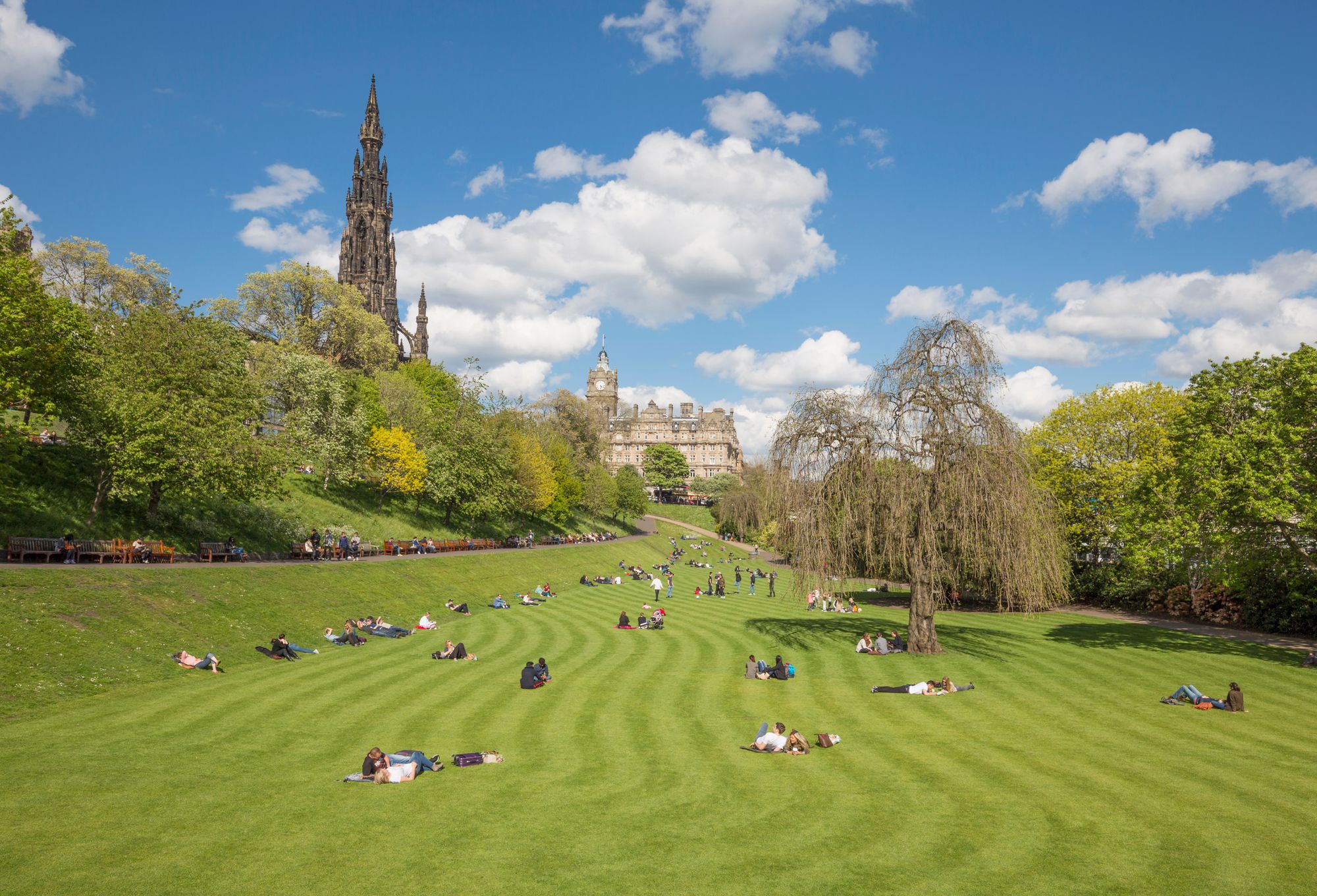 People enjoying the sun in Princes Street Gardens