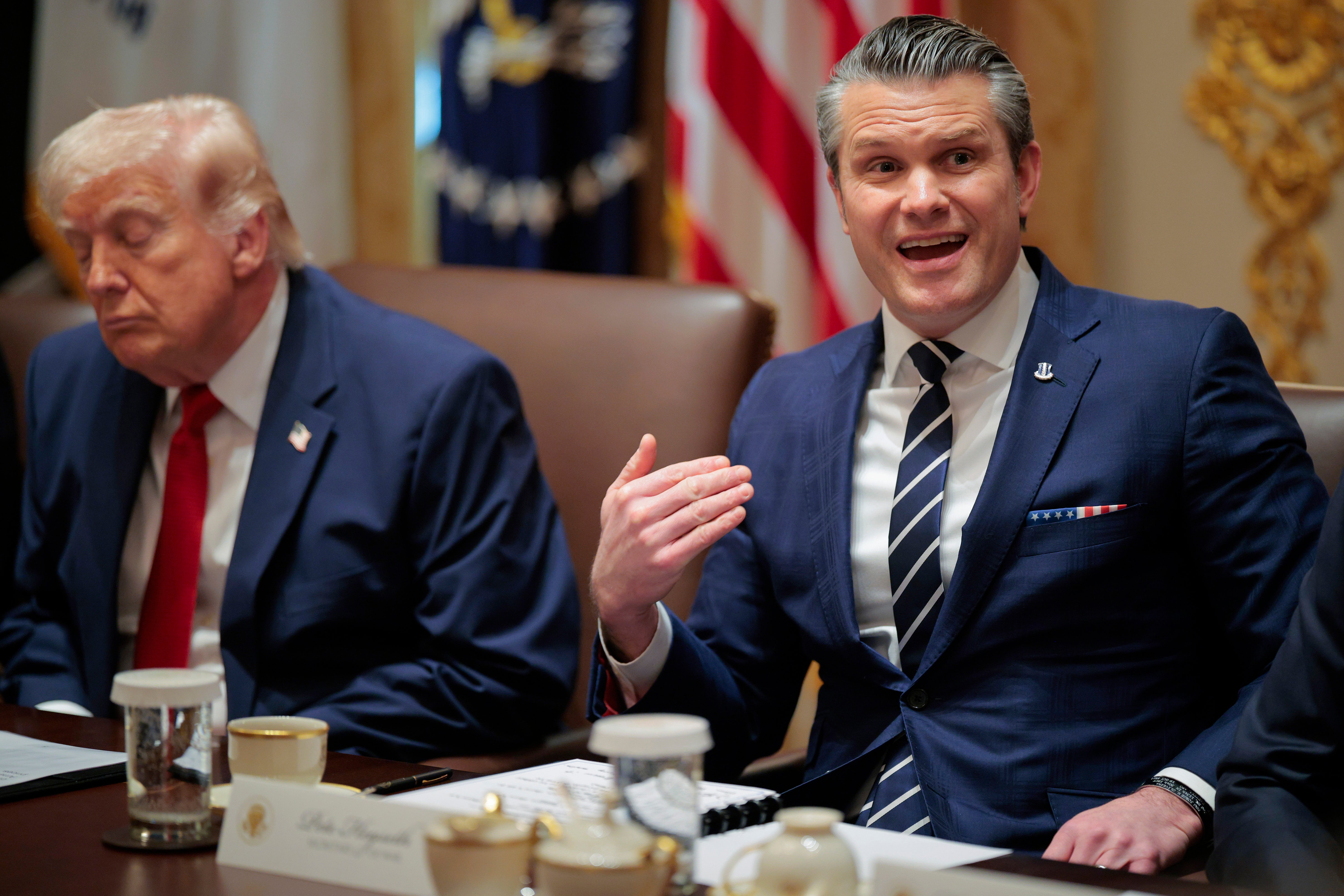 U.S. Secretary of War Pete Hegseth (R) speaks alongside U.S. President Donald Trump during a Cabinet meeting in the Cabinet Room of the White House on March 26, 2026 in Washington, DC
