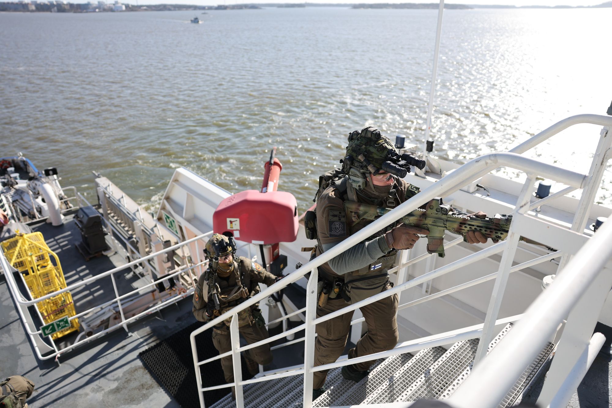 A member of the Finnish Border Guard takes part in an exercise, during the JEF leaders' visit on the Finnish Border Guard offshore patrol vessel Turva, prior to the Joint Expeditionary Force (JEF) summit