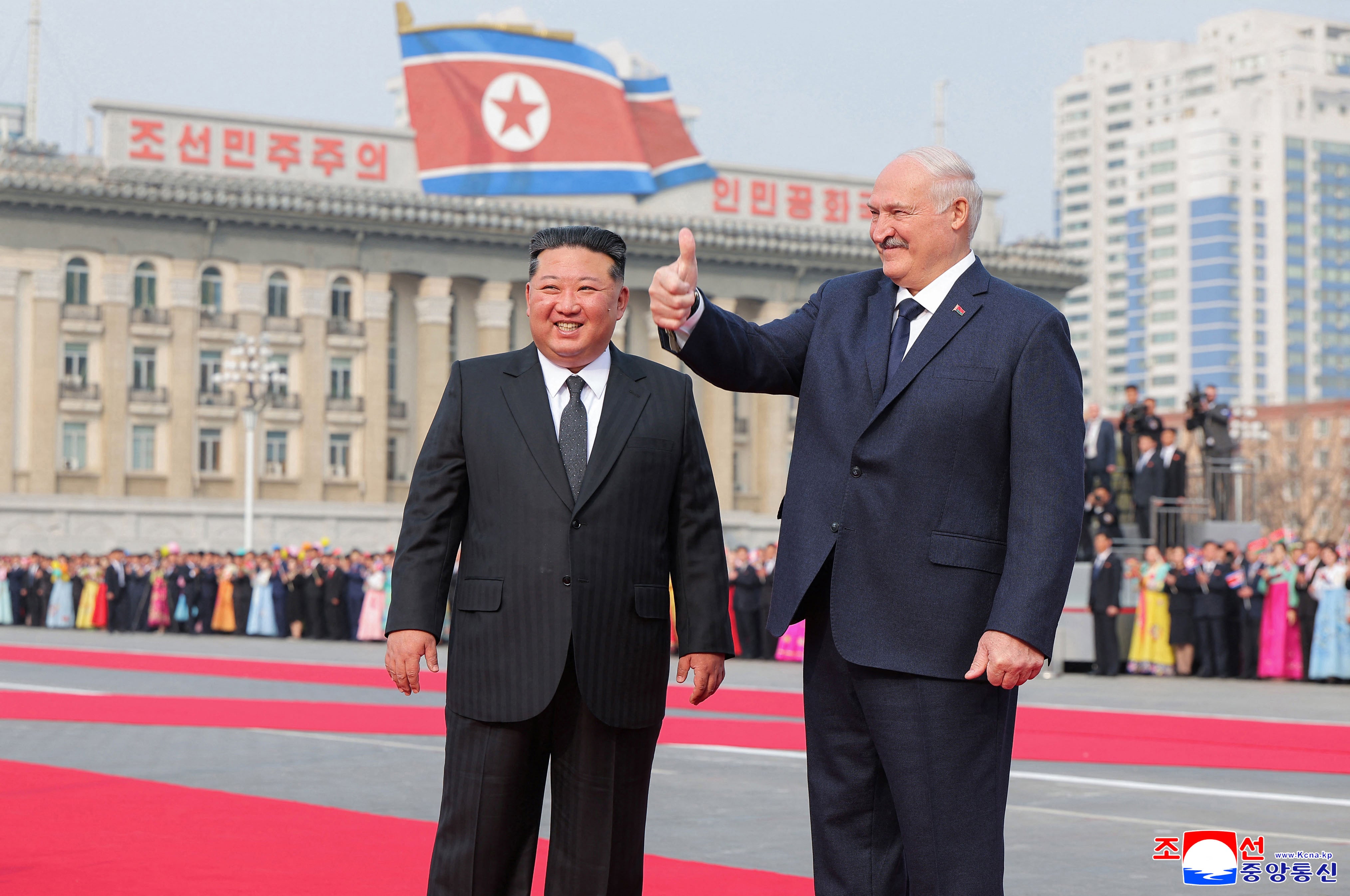 Kim Jong Un and Alexander Lukashenko attend a welcome ceremony at Kim Il Sung Square in Pyongyang