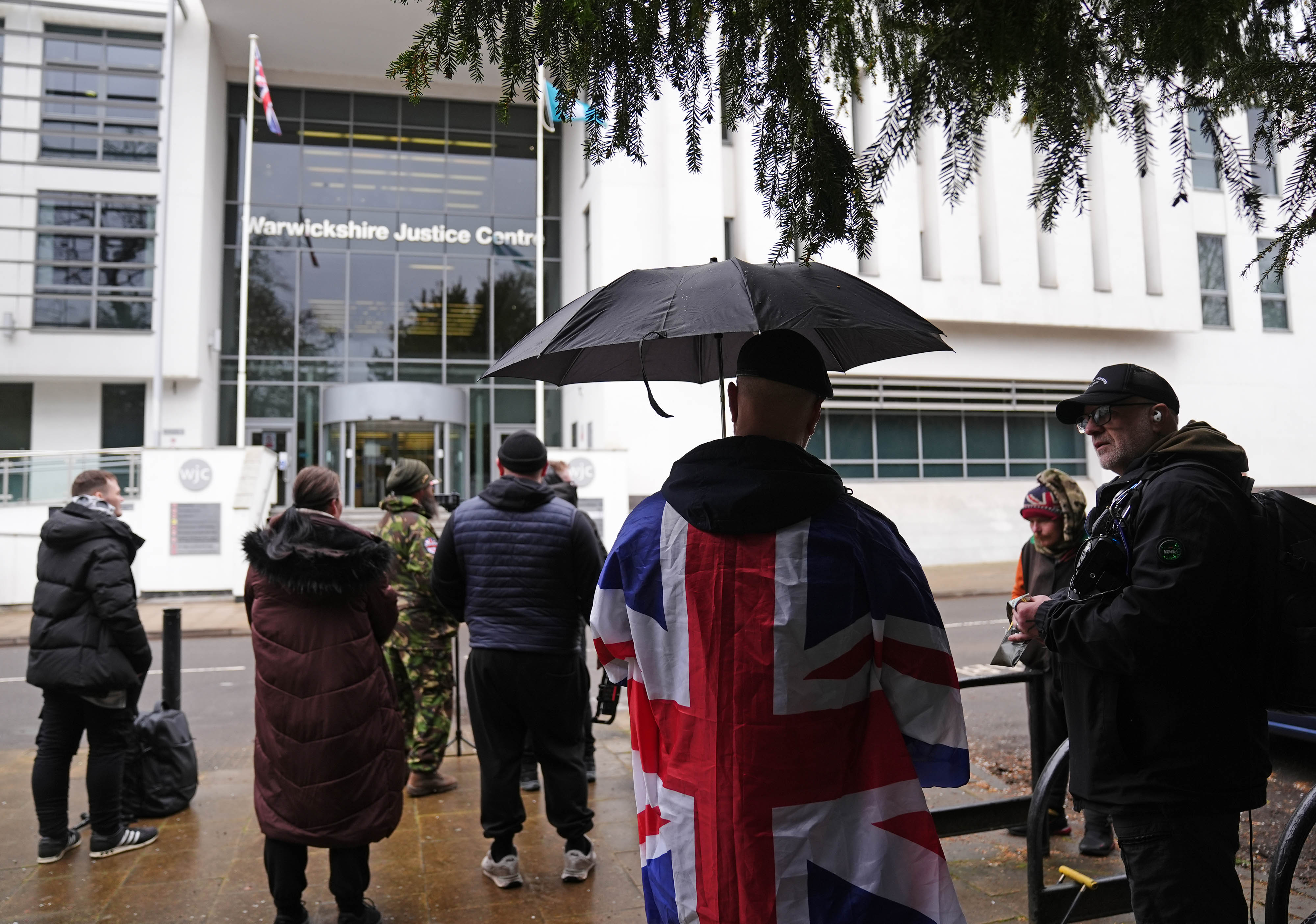 Protesters gather outside the court ahead of sentencing on Friday