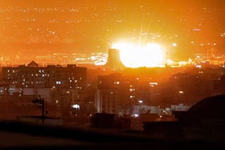 An explosion erupts following strikes near Azadi Tower close to Mehrabad International Airport in Tehran on March 7
