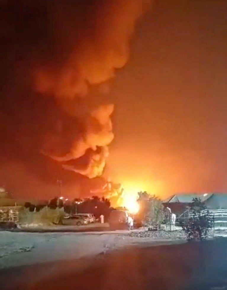 Smoke rises from an explosion in the direction of Ali Al Salem Air Base, amid the U.S.-Israeli conflict with Iran, in Al Jahra on 27 March.
