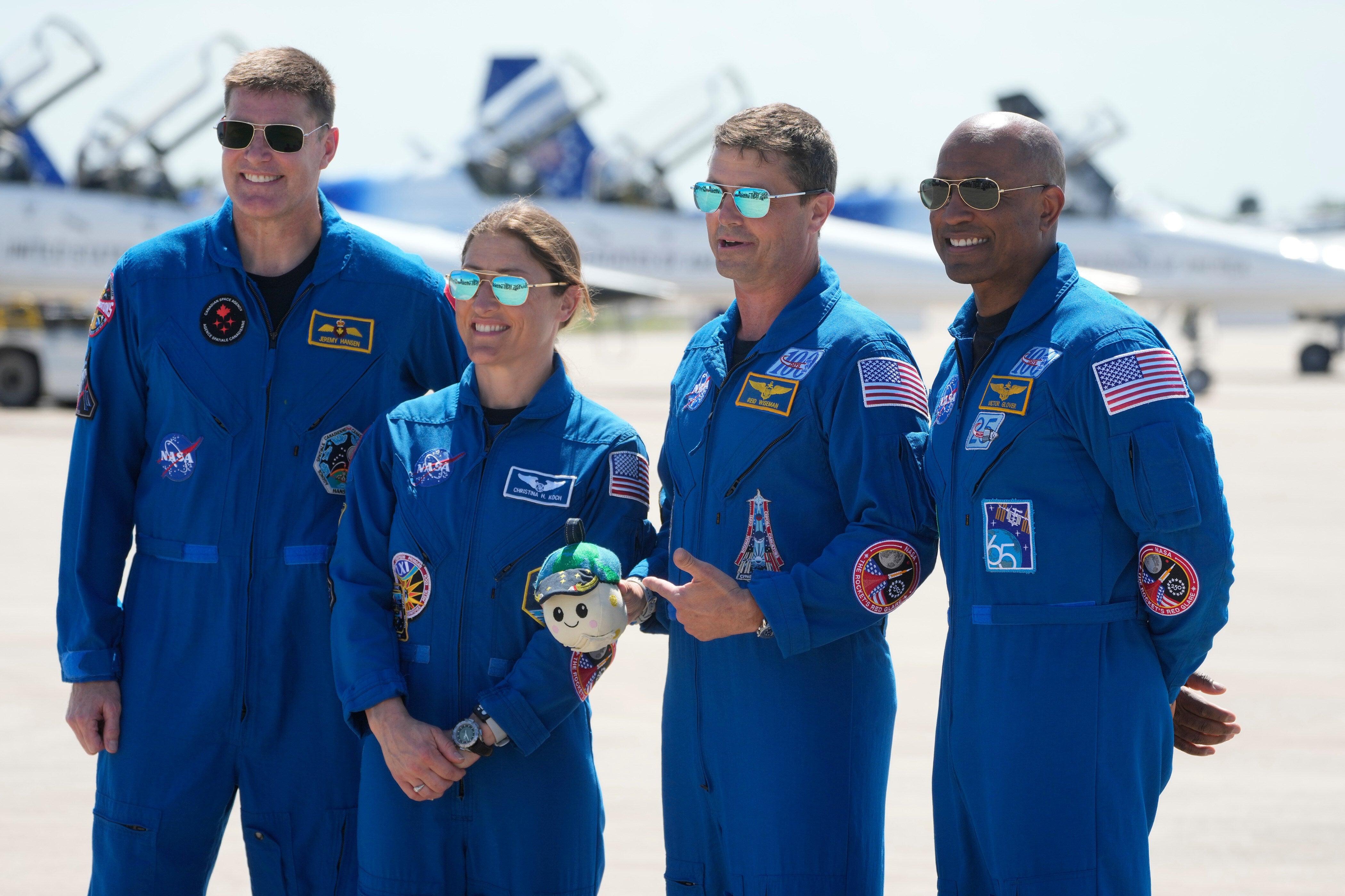 Artemis 2 crew members, from left, Mission Spc. Jeremy Hansen, of Canada, Mission Spc. Christina Koch, Commander Reid Wiseman, and Pilot Victor Glover pose for a photo after the crew's arrival at the Kennedy Space Center Friday, March 27, 2026