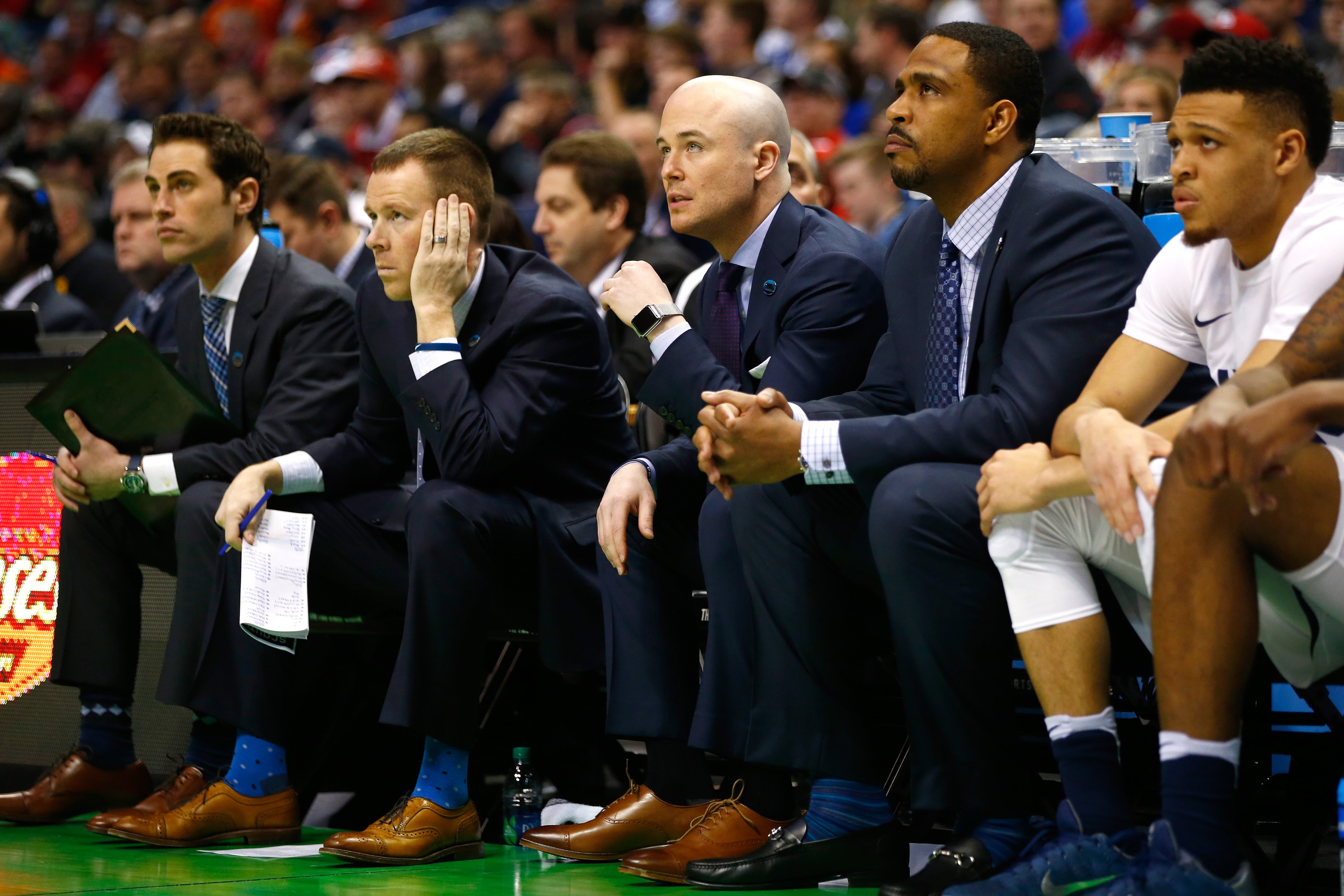 Luke Murray (middle) has been named the head coach of the men's basketball team at Boston College