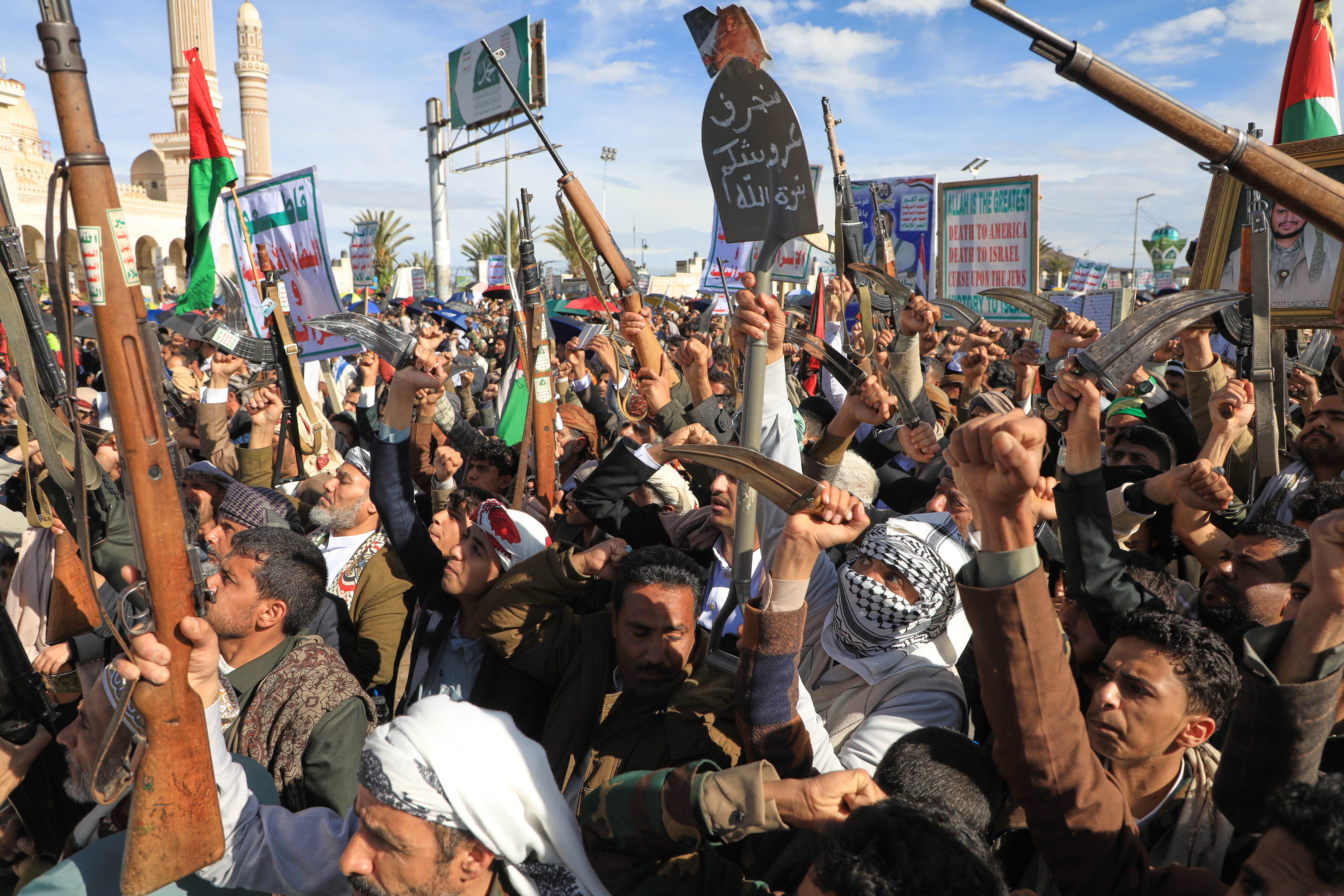 Houthi supporters shout slogans during a rally against Israel and the United States' war in Iran, in Sanaa, Yemen