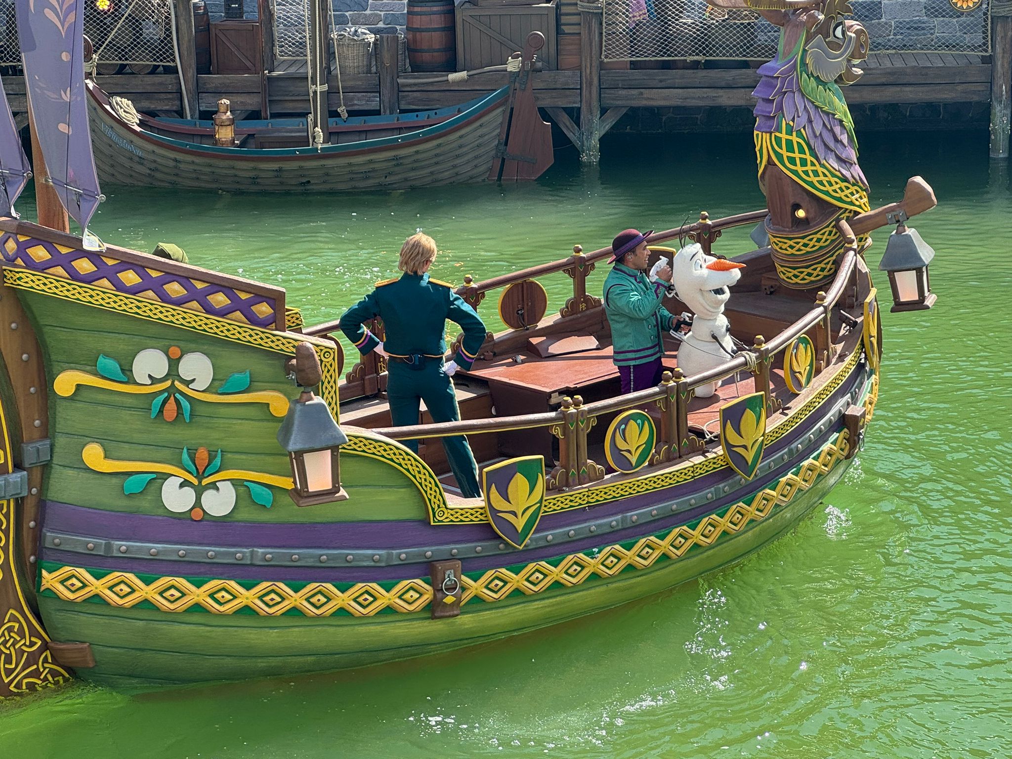 Frozen characters on Viking-style show barges perform uplifting new songs by Kristen Anderson-Lopez and Robert Lopez