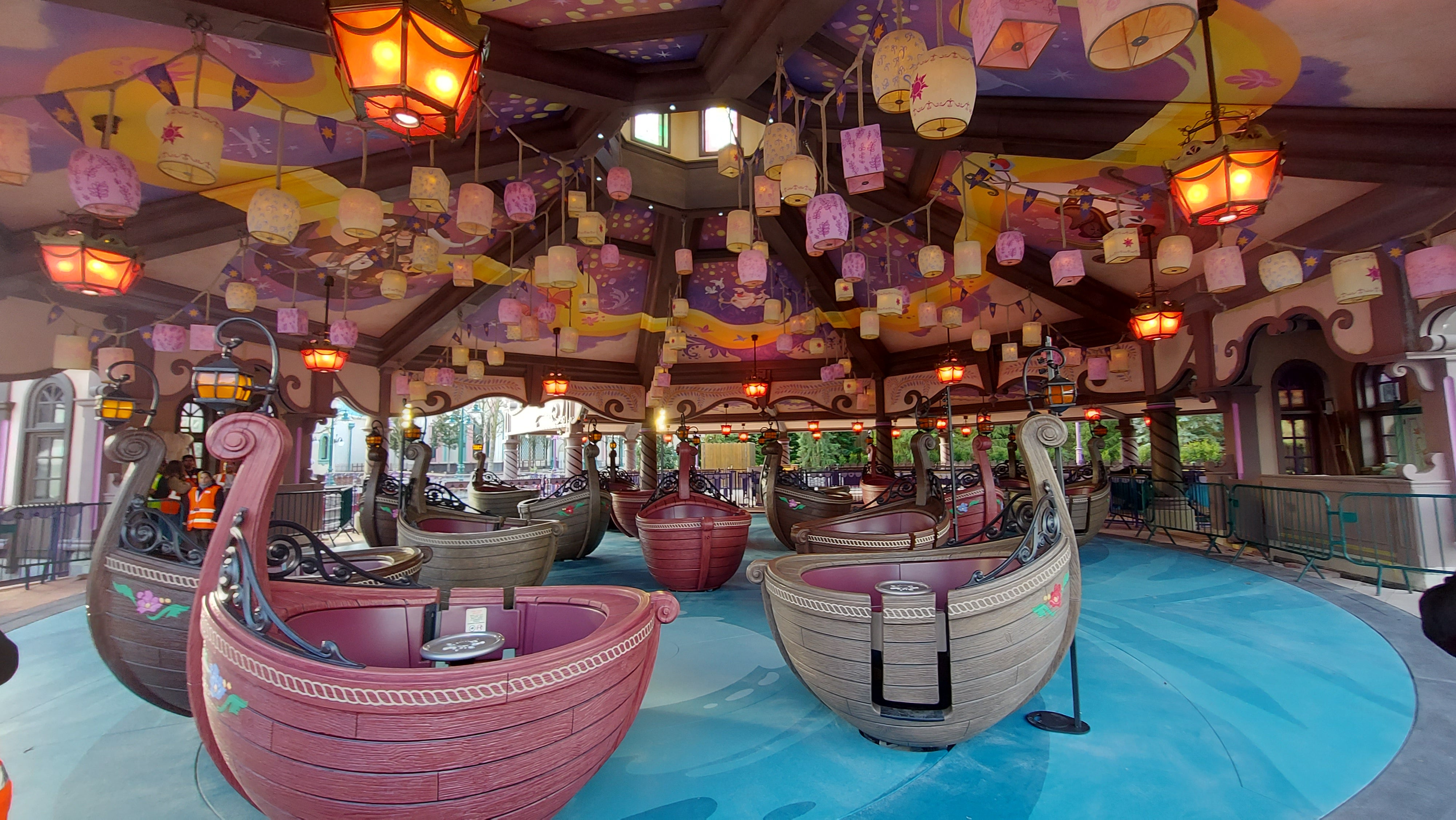 The Raiponce Tangled Spin ride, where gondolas whirl beneath frescoes depicting Rapunzel’s adventures in animation Tangled
