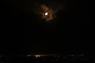 The moon illuminates the sky above Beirut's southern suburbs, amid escalating hostilities between Israel and Hezbollah, as the US-Israeli conflict with Iran continues, in Lebanon