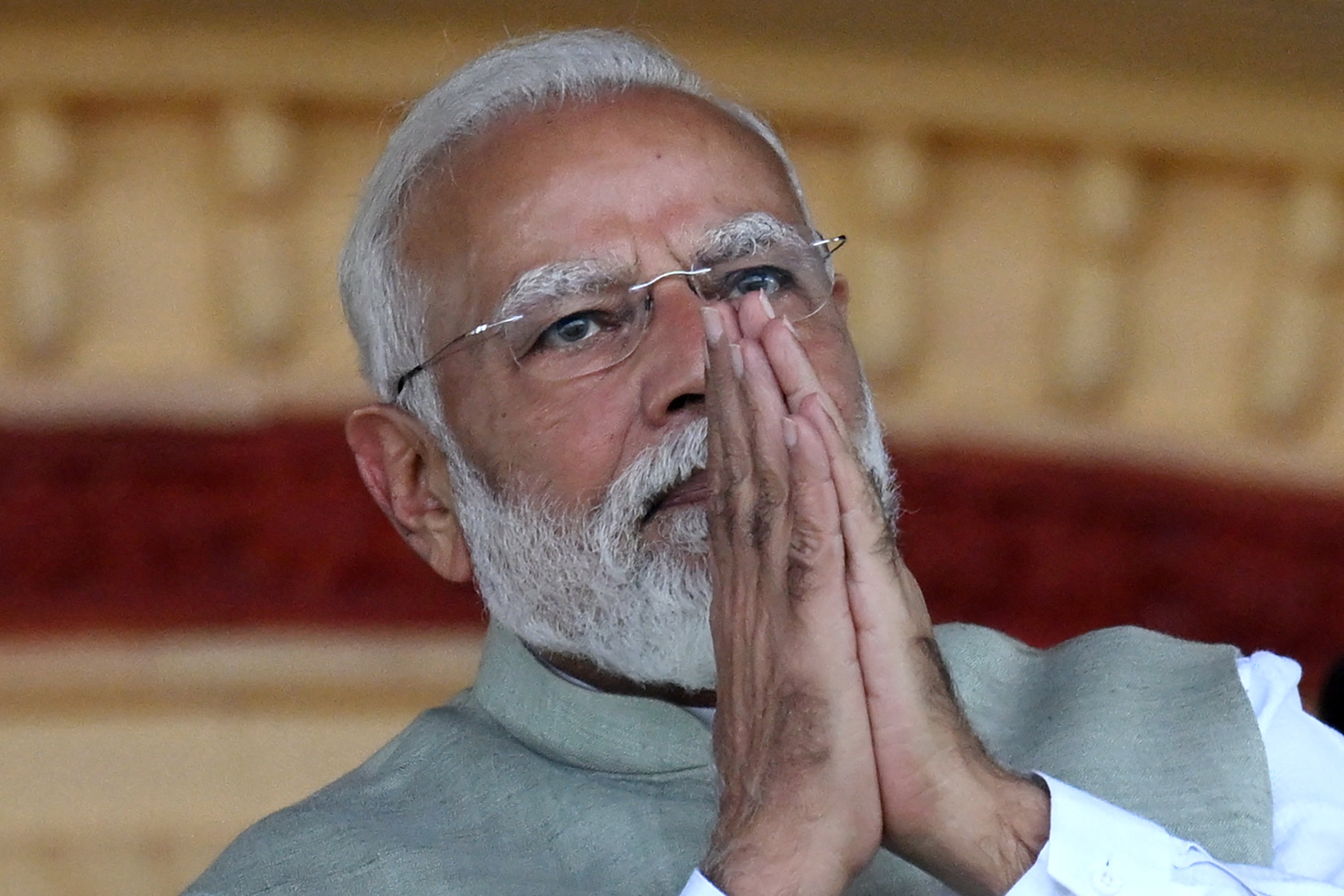 Indian prime minister and Bharatiya Janata Party (BJP) leader Narendra Modi greets supporters