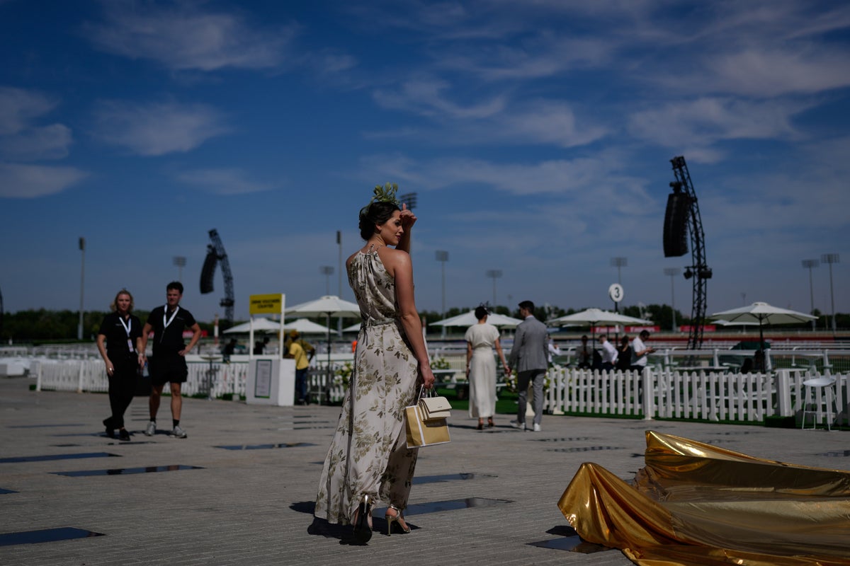 Photos show glamour at the Dubai World Cup horse race but thinner crowds due to Iran war