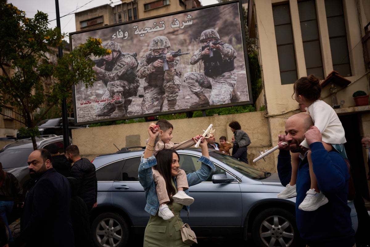 Photos show Lebanon's Catholics marking Palm Sunday as the shadow of war weighs heavily
