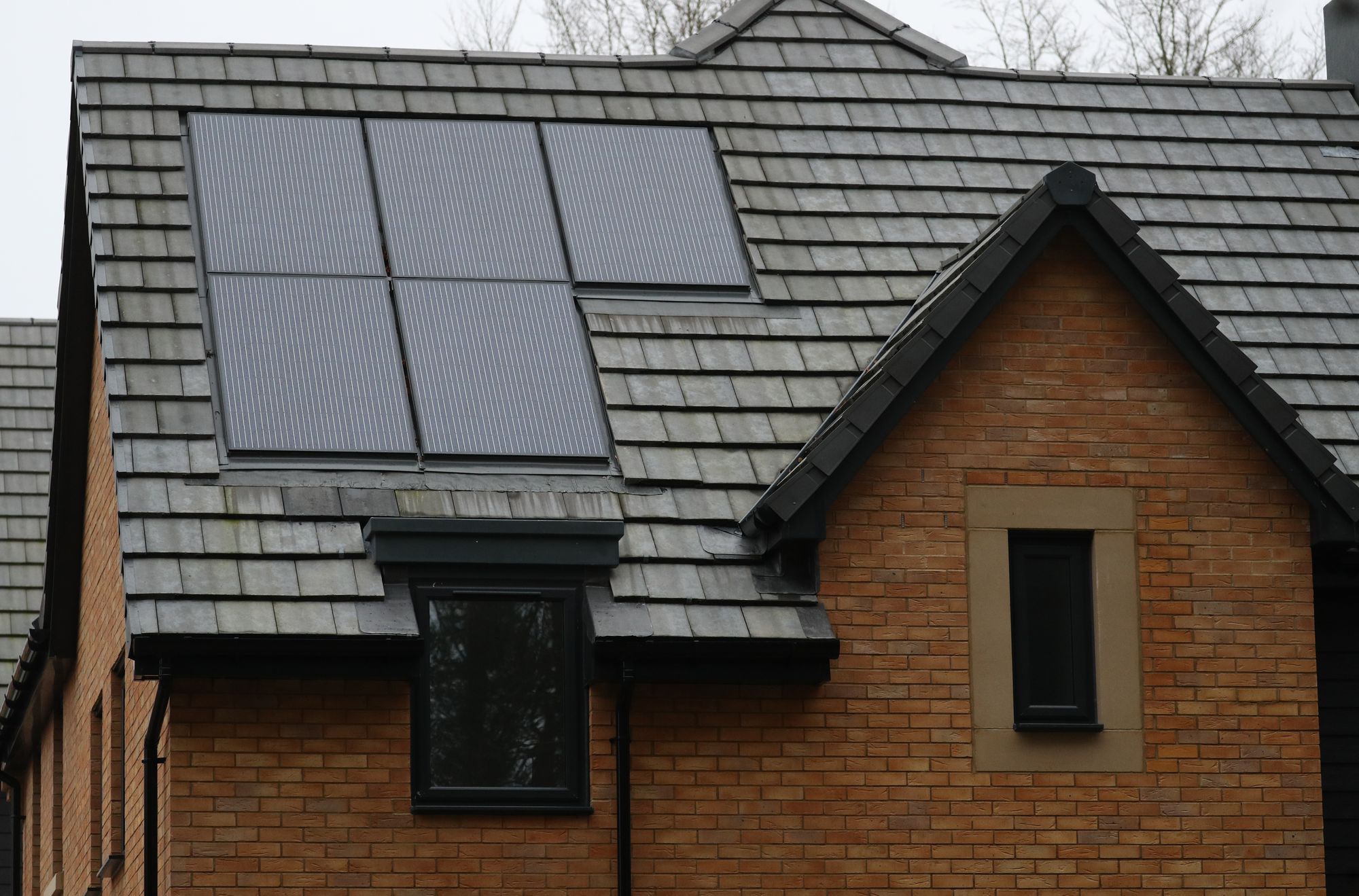 Solar panels on the roof of a property on a housing development in Basingstoke, Hampshire