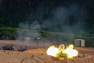 An Israeli artillery unit fires towards Lebanon, amid escalating hostilities between Israel and Hezbollah