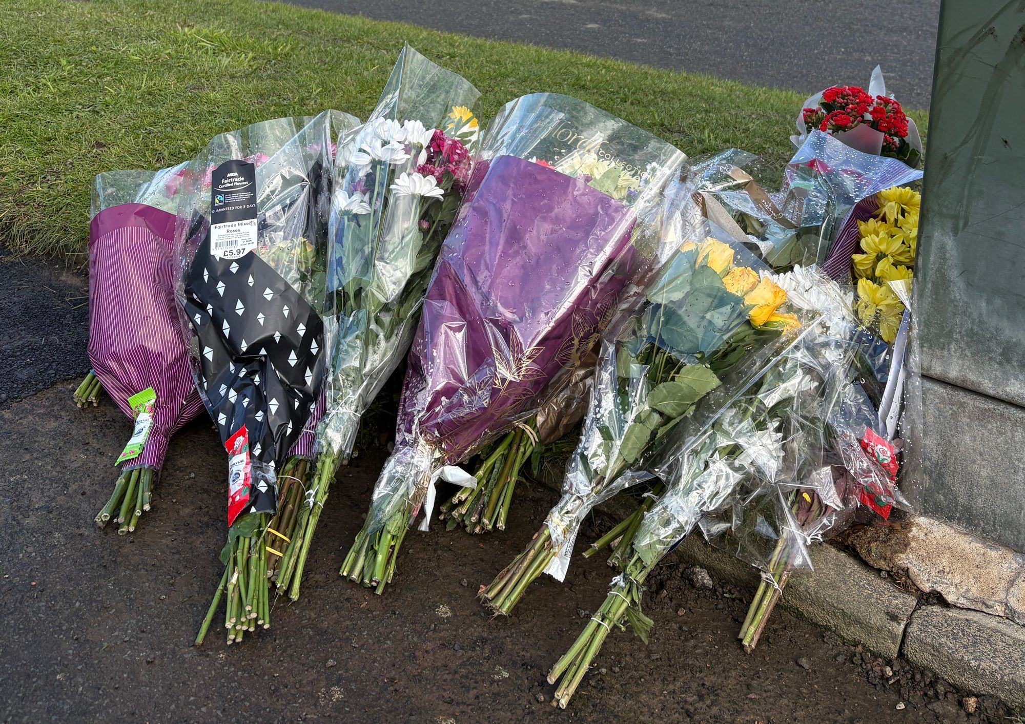 Tributes left at the scene in Kennerleigh Avenue, in the Austhorpe area of Leeds
