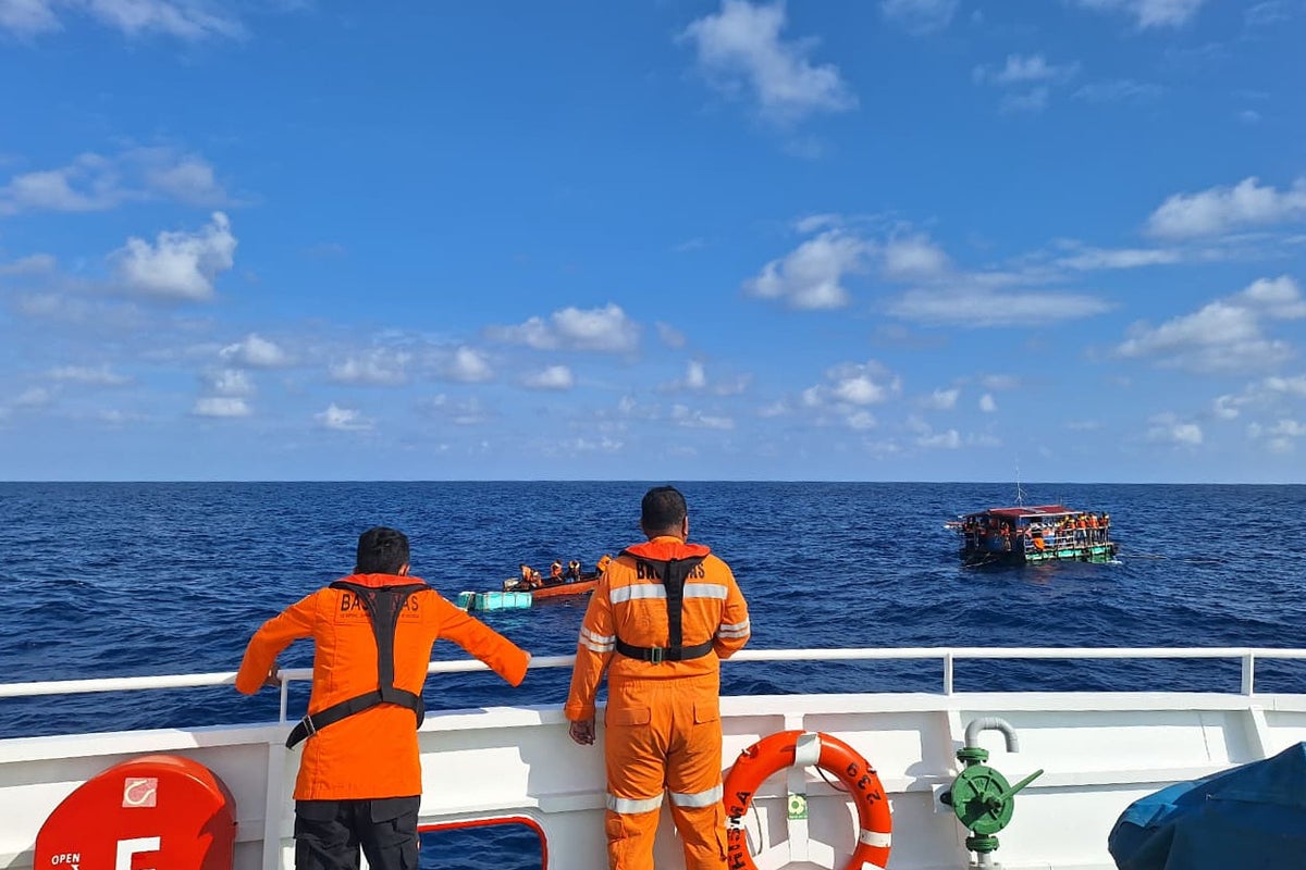Rescue teams in race against time to find 27 missing people after passenger boat sinks in Indonesia