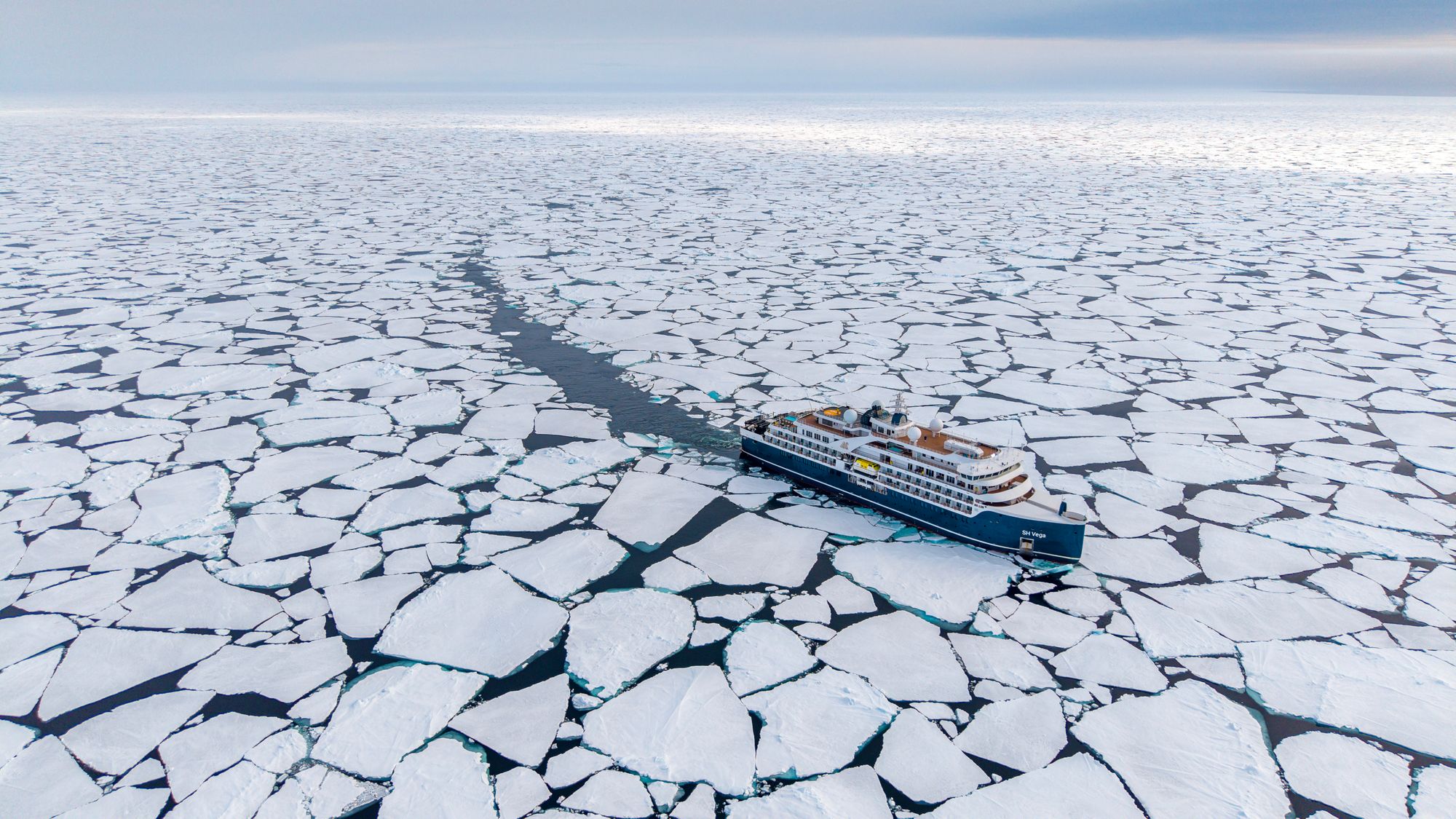 Swan Hellenic cruise ship, SH Vega, navigates pack ice in Antarctica