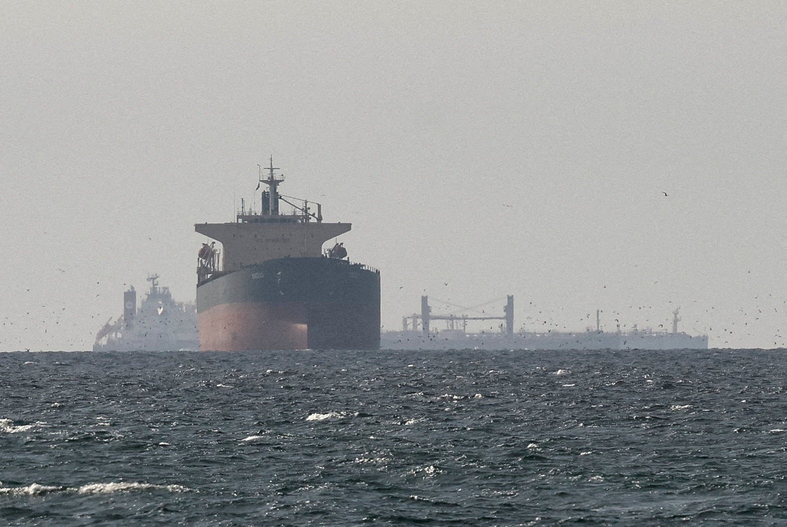 Cargo ships in the Gulf, near the Strait of Hormuz, as seen from northern Ras al-Khaimah