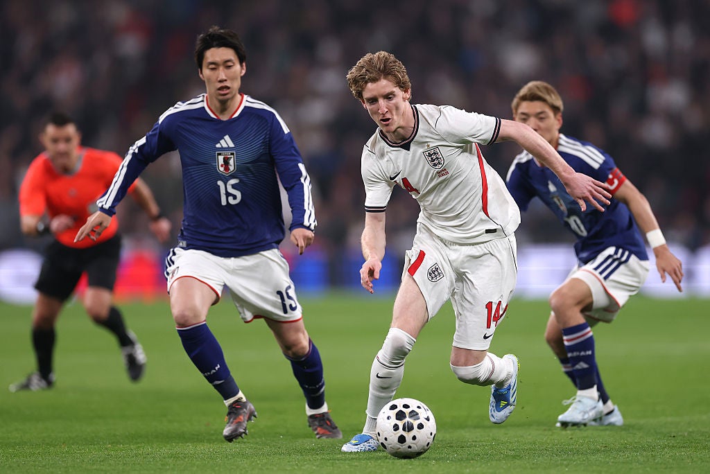 Anthony Gordon tries to make inroads against Japan.