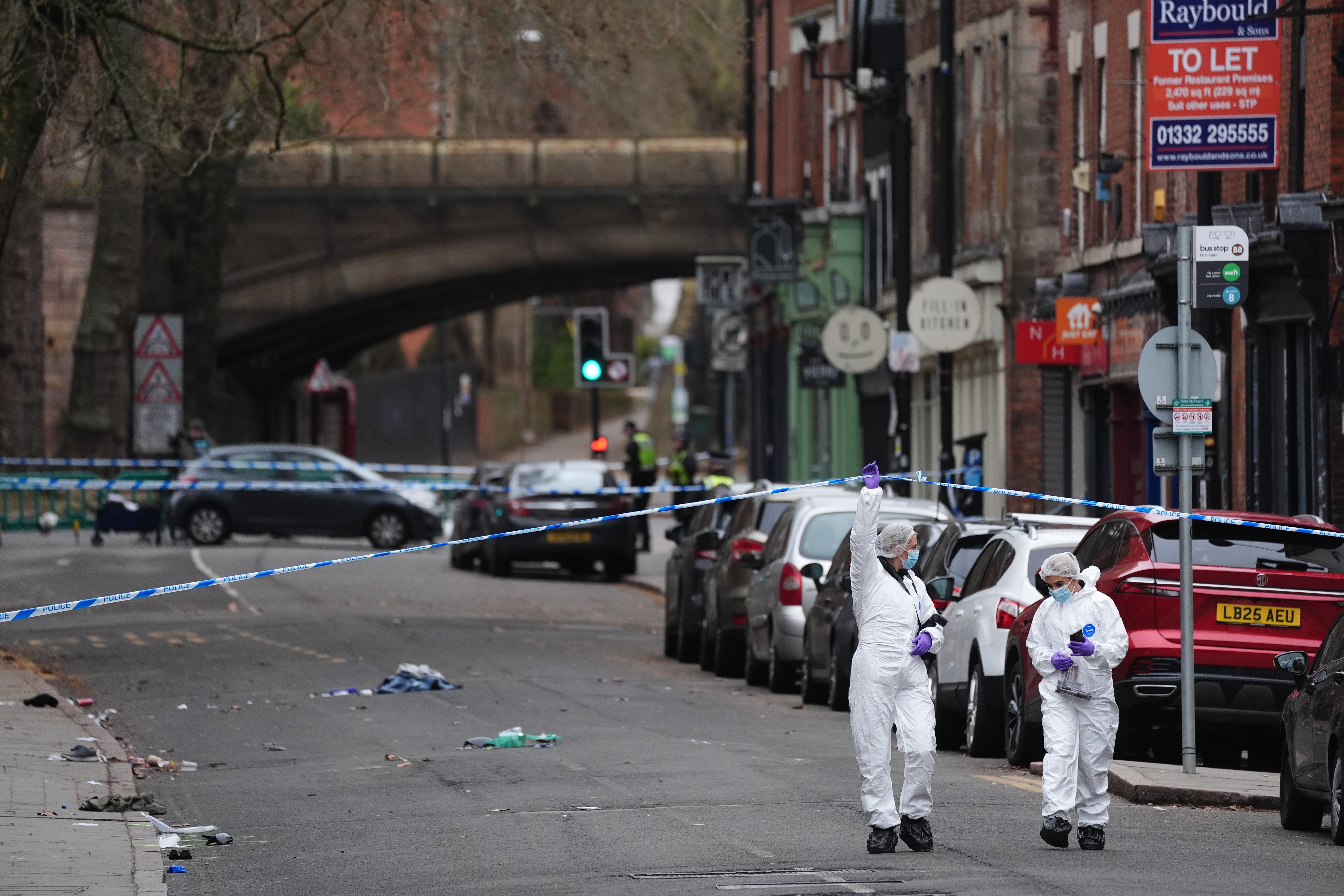 Forensic investigators at the scene at Friar Gate (Jacob King/PA)
