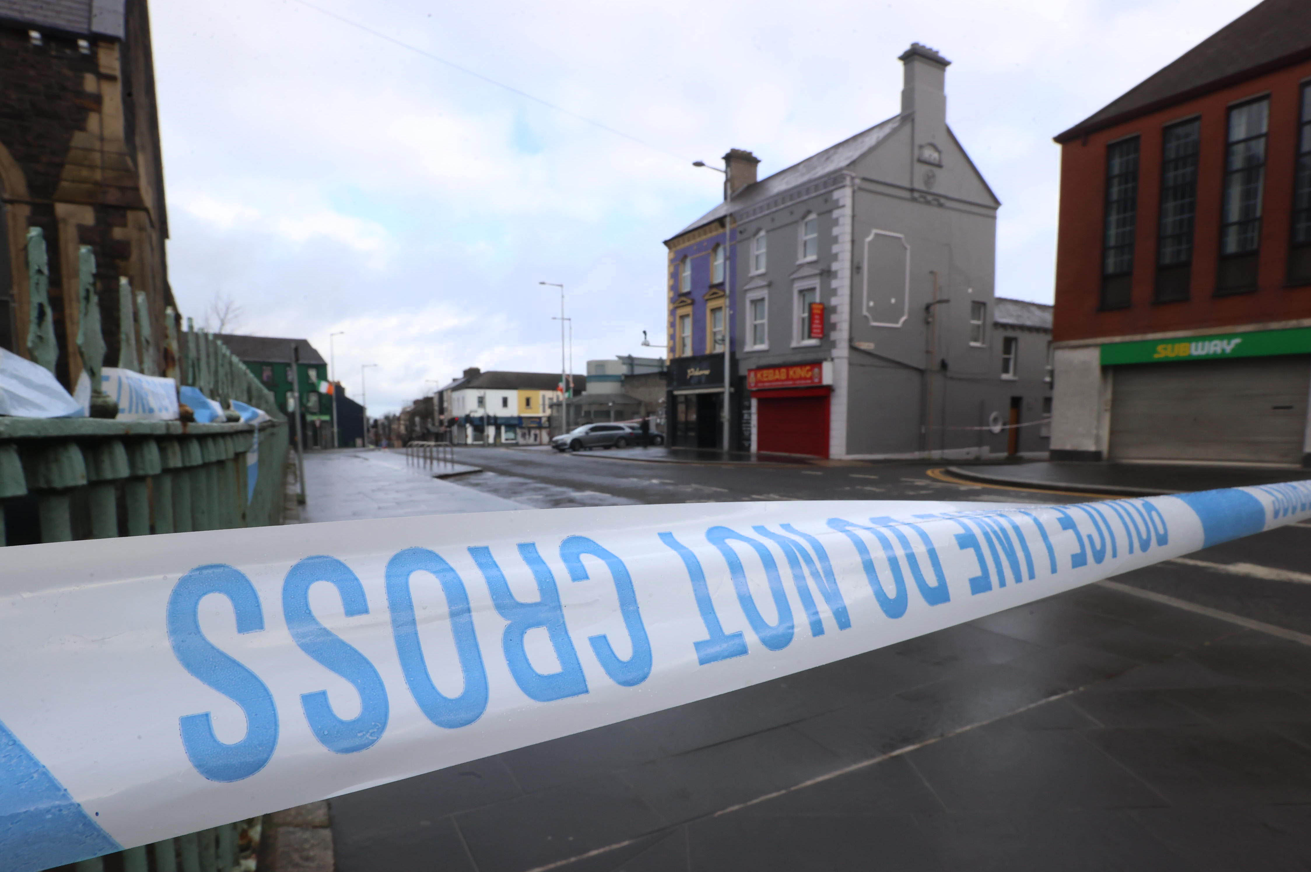 Police Service of Northern Ireland (PSNI) tape near the police station in Lurgan, Co Armagh after a delivery driver was threatened at gunpoint and forced to drive his car with an object inside to the town's police station, sparking a security alert