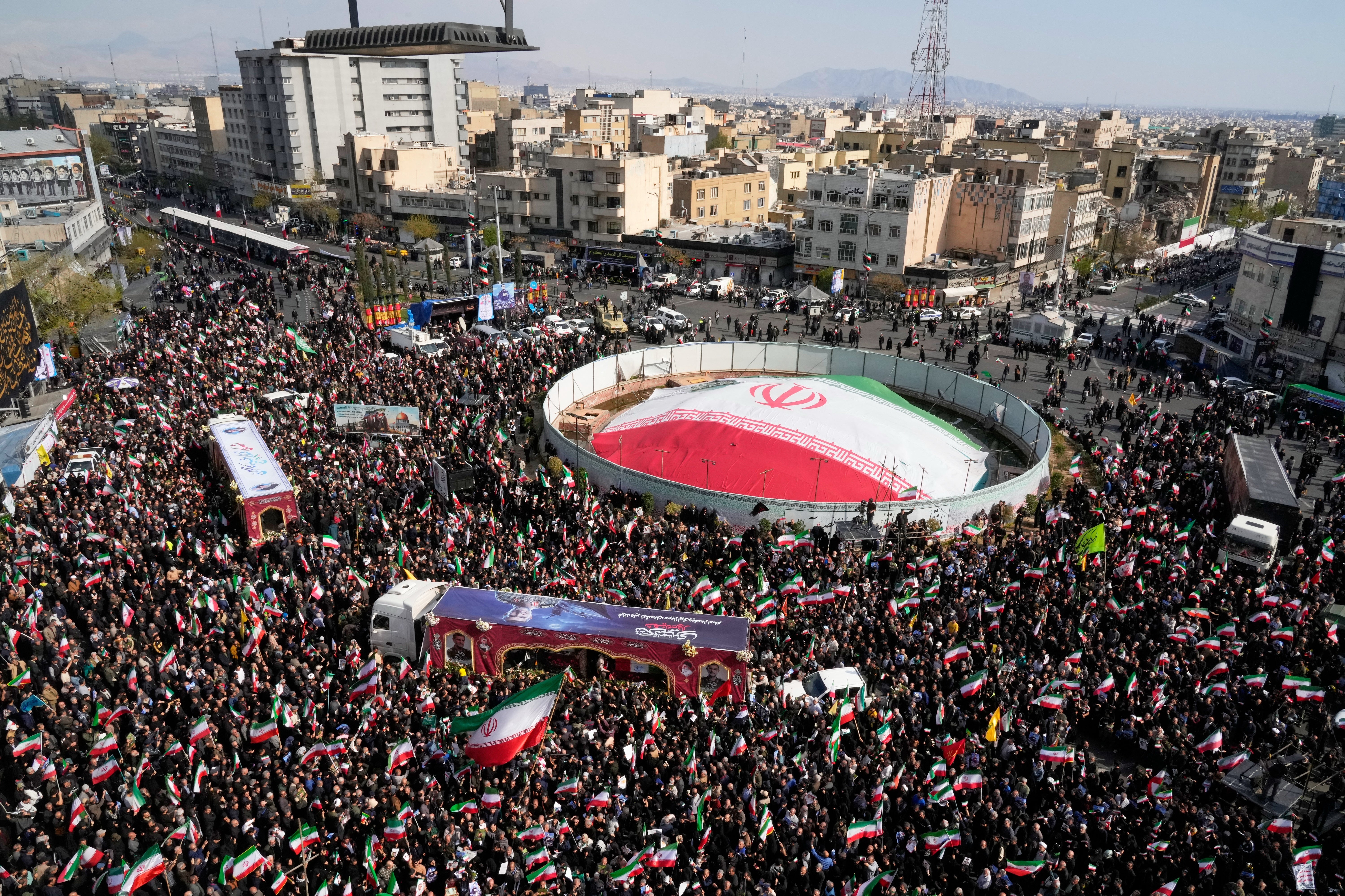 Mourners gather during a funeral procession for Alireza Tangsiri, head of Iran's Islamic Revolutionary Guard Corps Navy, and others killed in Israeli strikes in late March, in Tehran, Iran