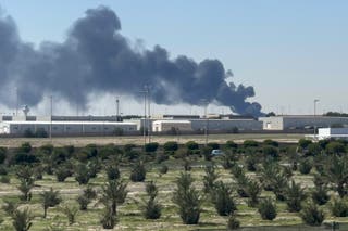 Smoke rises from an area of Kuwait's international airport after a reported drone strike on April 1, 2026. Kuwait's civil aviation authority said that the Gulf state's international airport had come under an Iranian drone attack that led to "a large fire" at a fuel depot.