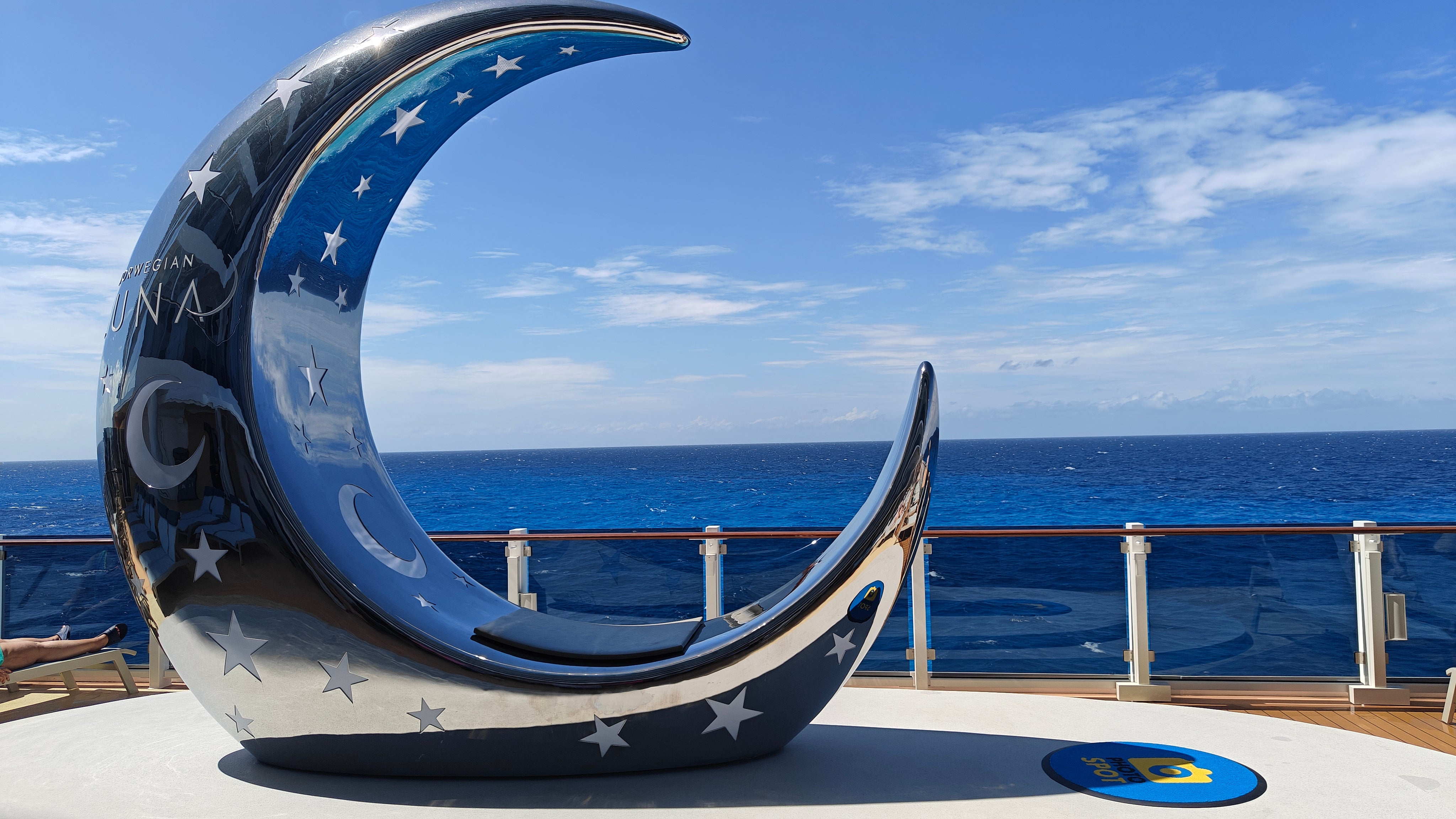 A crescent sculpture on Norwegian Luna's Ocean Boulevard provides a perfect selfie spot