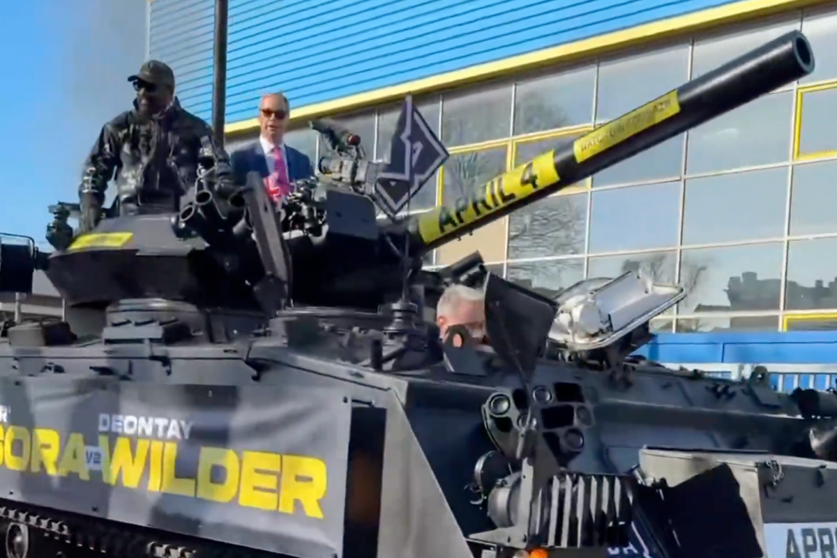 Derek Chisora arrives for Wilder press conference in tank with Farage