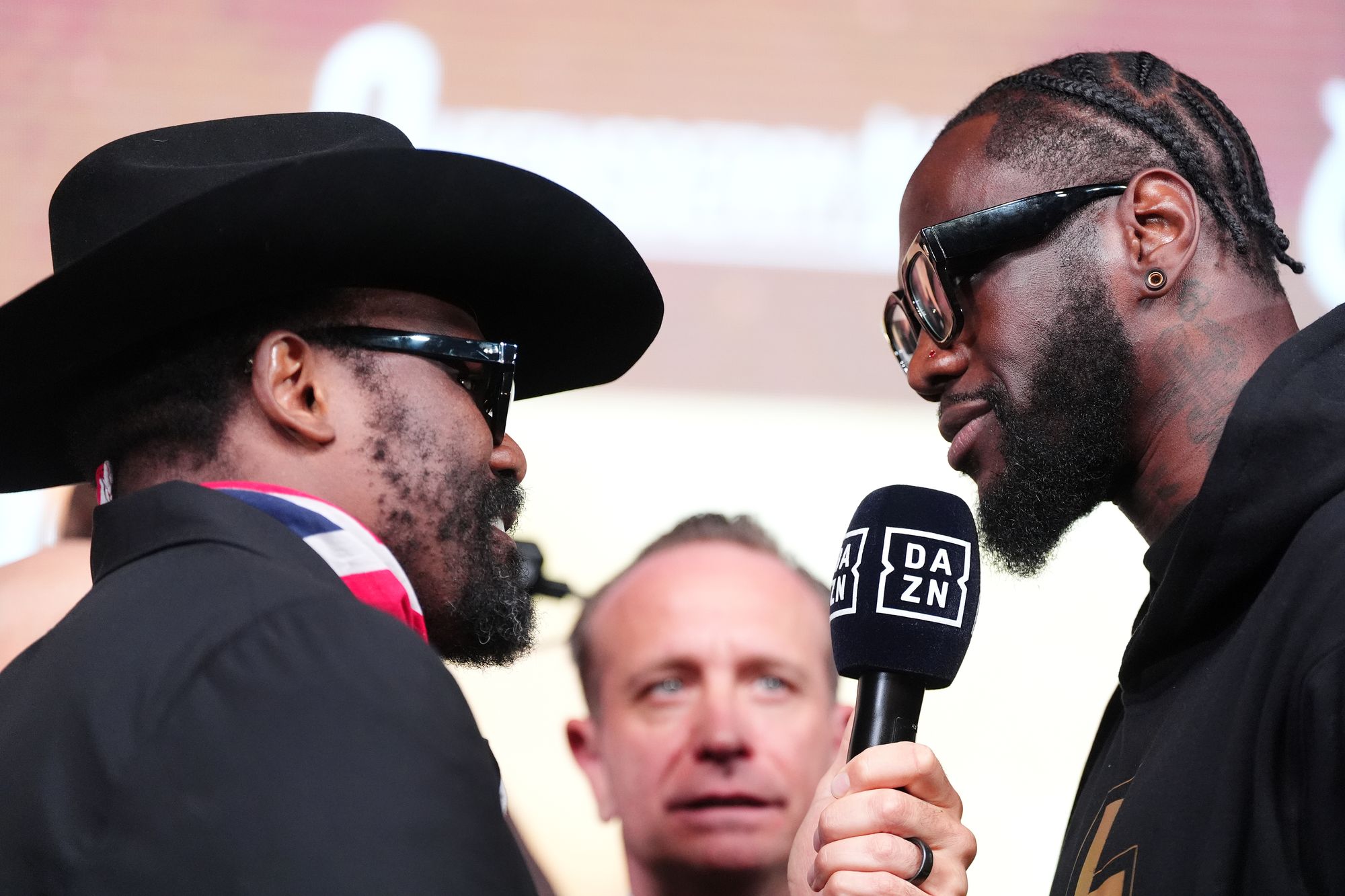 Derek Chisora (left) and Deontay Wilder exchanging words at their pre-fight press conference