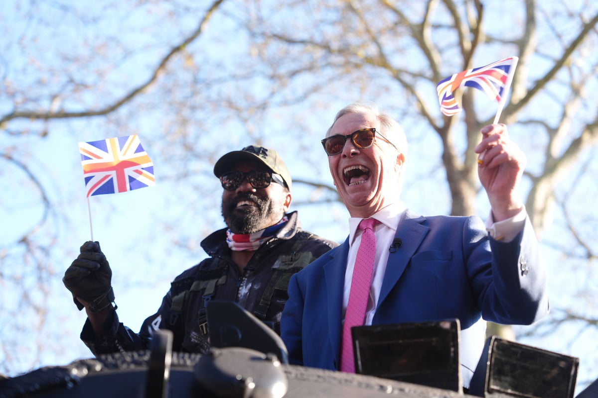Derek Chisora arrives at media event in army tank with Nigel Farage