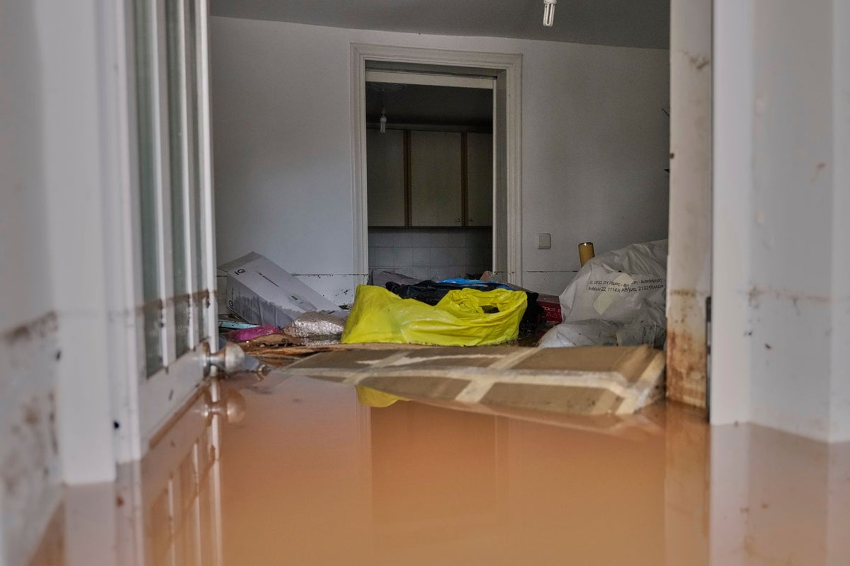 Man dies in Greek holiday town as devastating storm floods homes and causes travel chaos