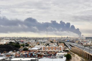 Smoke rises from Kuwait international airport after a drone strike on fuel storage