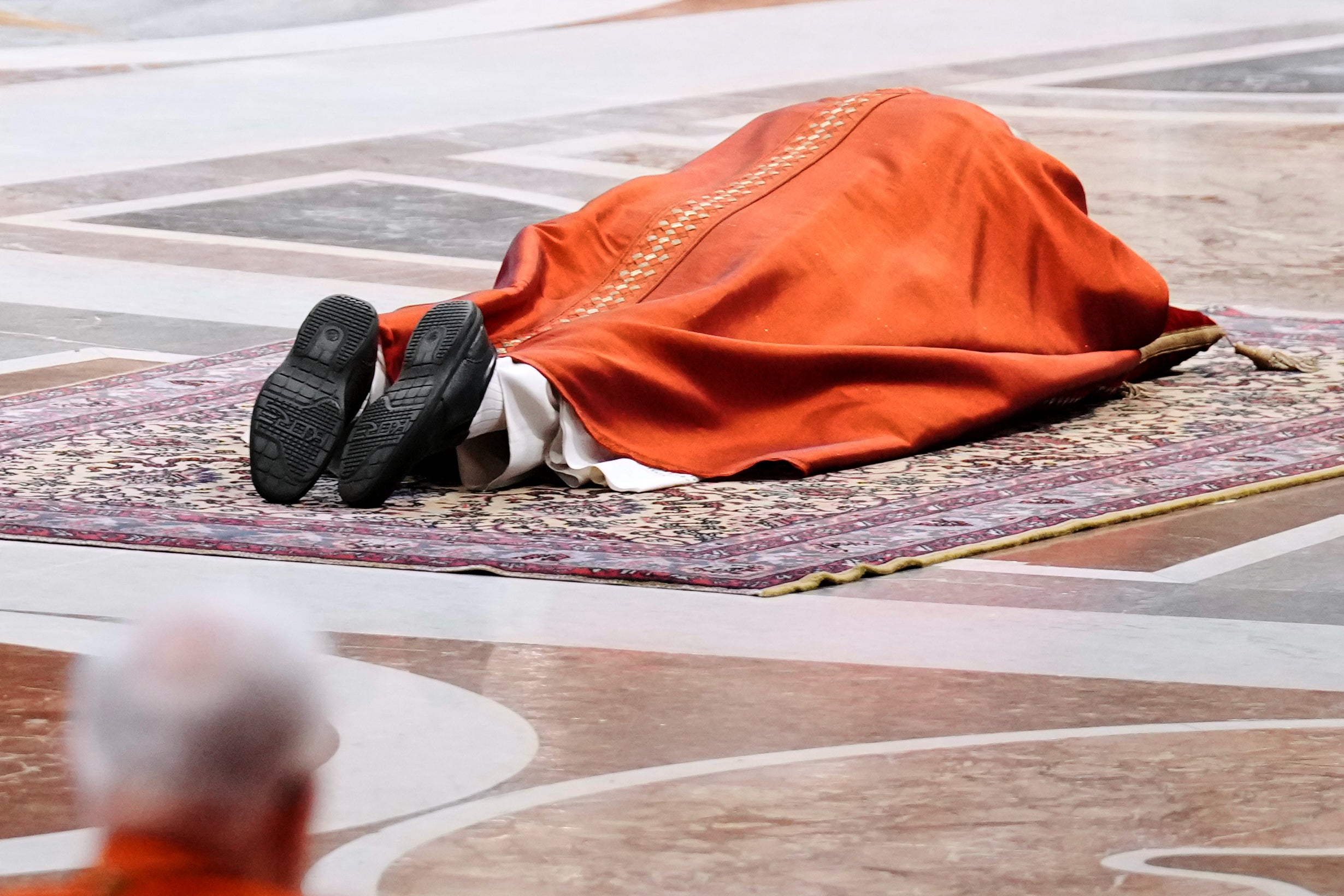 Pope Leo lies prostrate at Celebration of the Passion of the Lord in St. Peter's Basilica at the Vatican on Catholic Good Friday