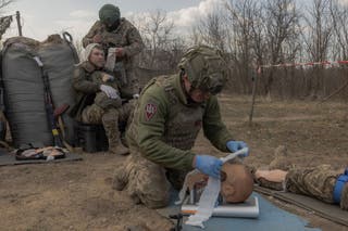 Ukrainian recruits of Air Assault Forces practice combat first aid during a basic military training, in a training center, at an undisclosed location on 27 March 2026, amid the Russian invasion of Ukraine.