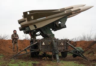 A Ukrainian serviceman works with a US-manufactured Hawk medium-range surface-to-air missile system at a position in Mykolaiv region