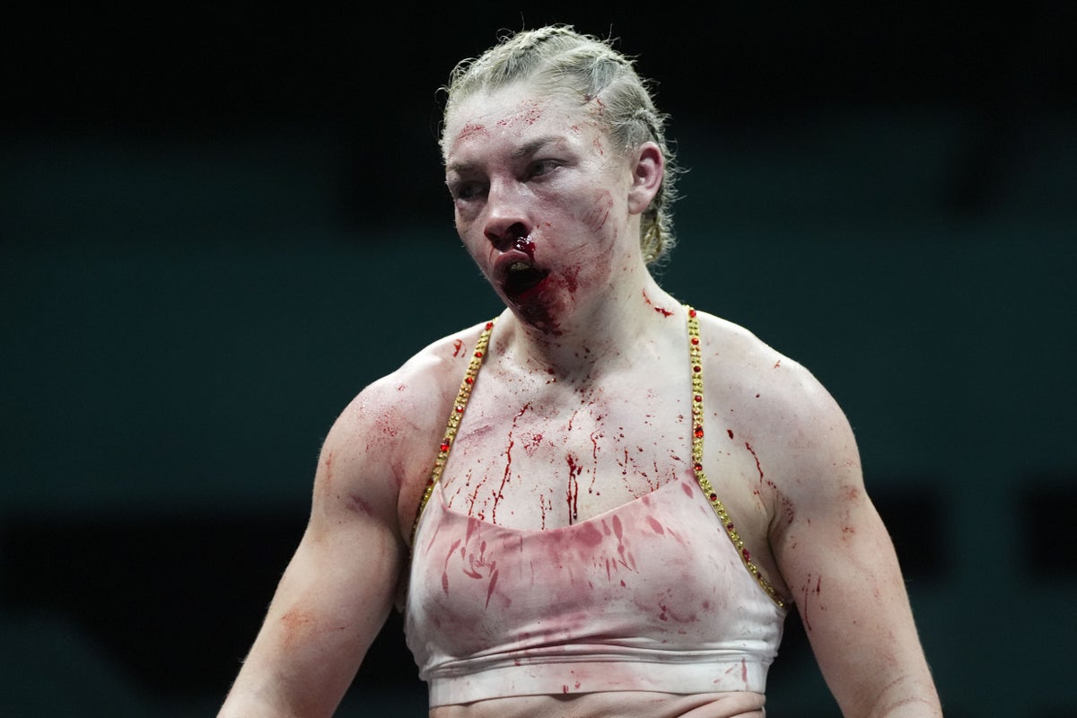 Lauren Price comes through toughest battle yet to retain world titles in Cardiff