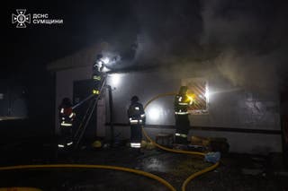 Ukrainian Emergency Services on Saturday, April 4, 2026, rescue workers put out a fire of a residential building damaged following a Russian strike in Sumy, Ukraine