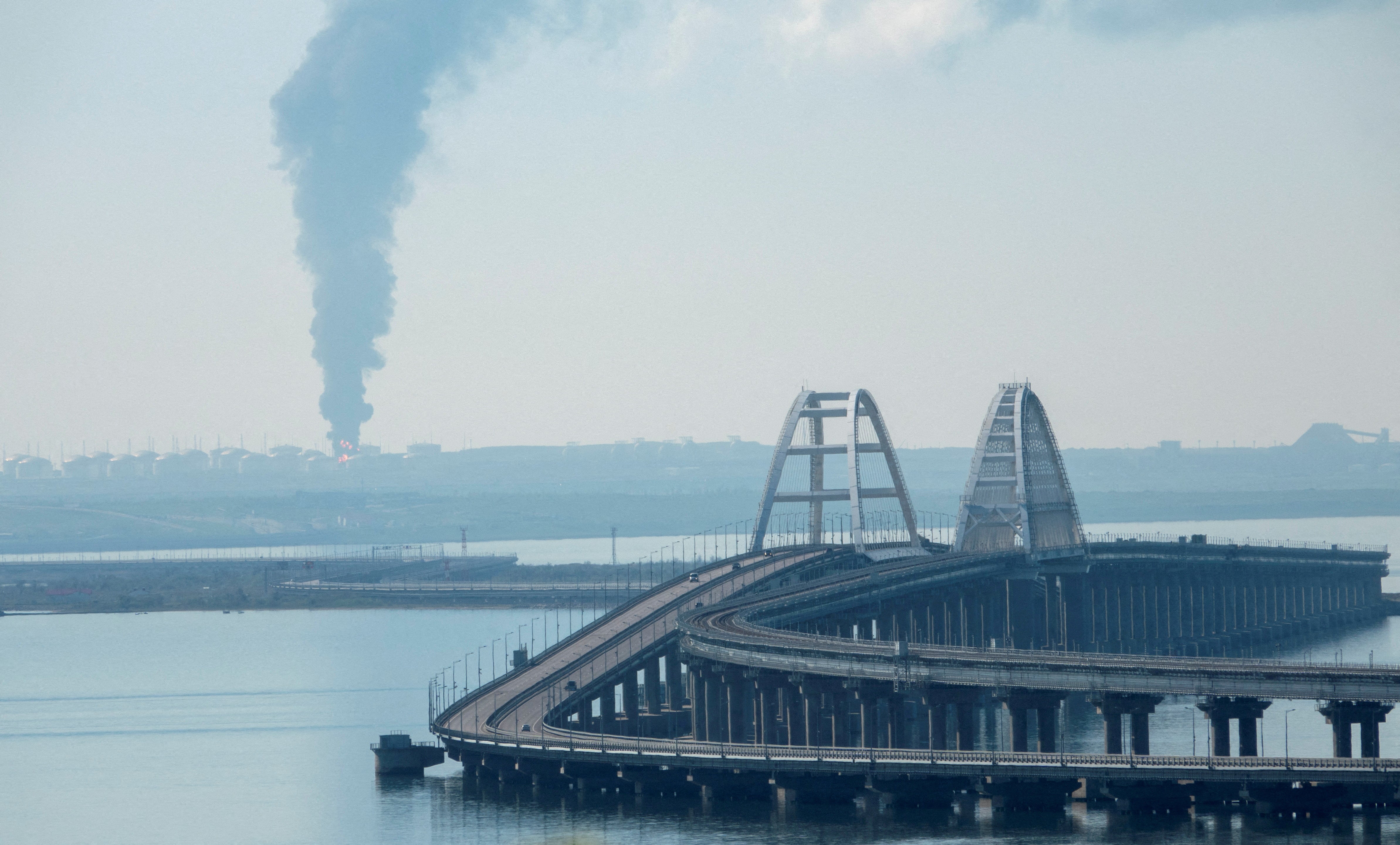 File photo: A view across the Kerch Strait shows smoke rising above a fuel depot near the Crimean bridge